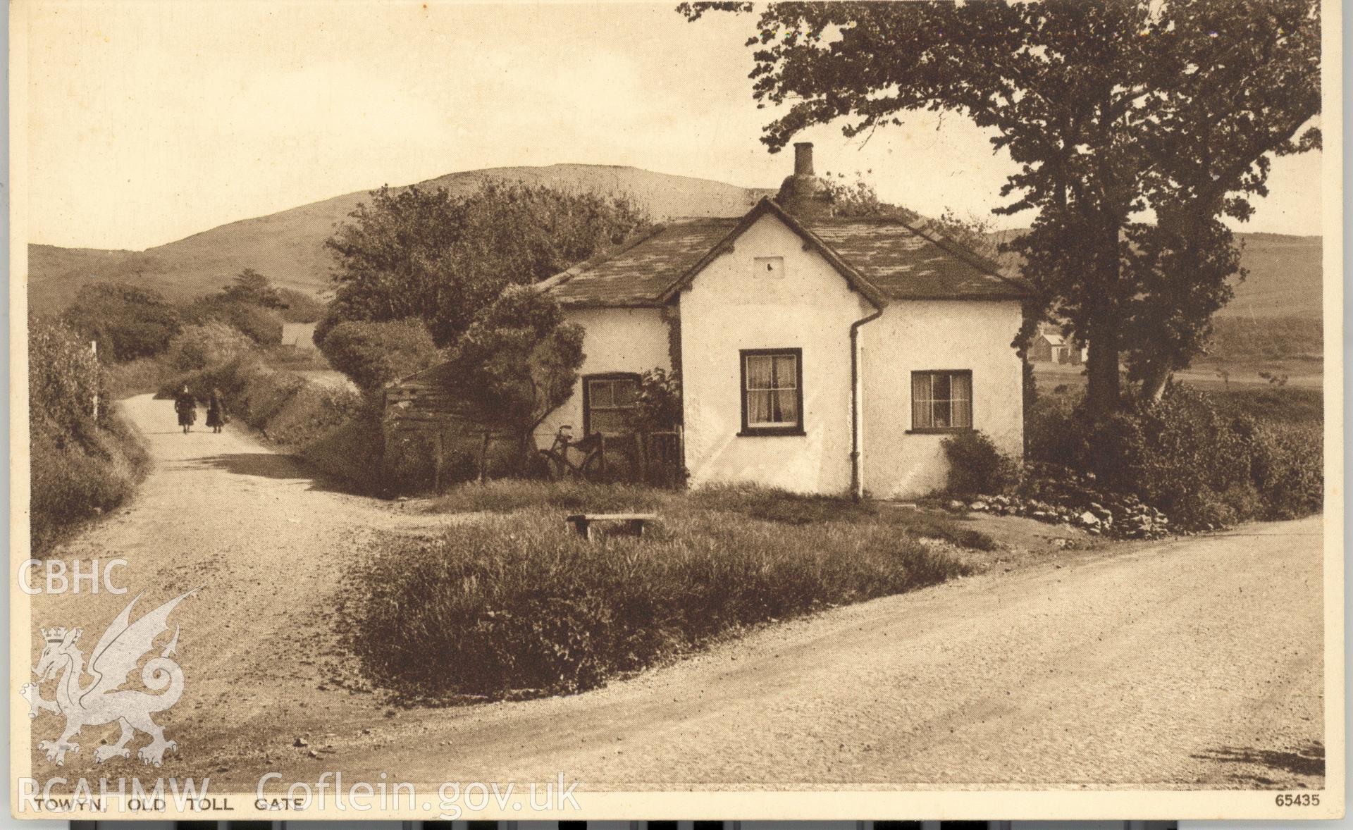 Digitised postcard image of Tollgate Cottage, Tywyn, Photochrom Co. Ltd. Produced by Parks and Gardens Data Services, from an original item in the Peter Davis Collection at Parks and Gardens UK. We hold only web-resolution images of this collection, suitable for viewing on screen and for research purposes only. We do not hold the original images, or publication quality scans.