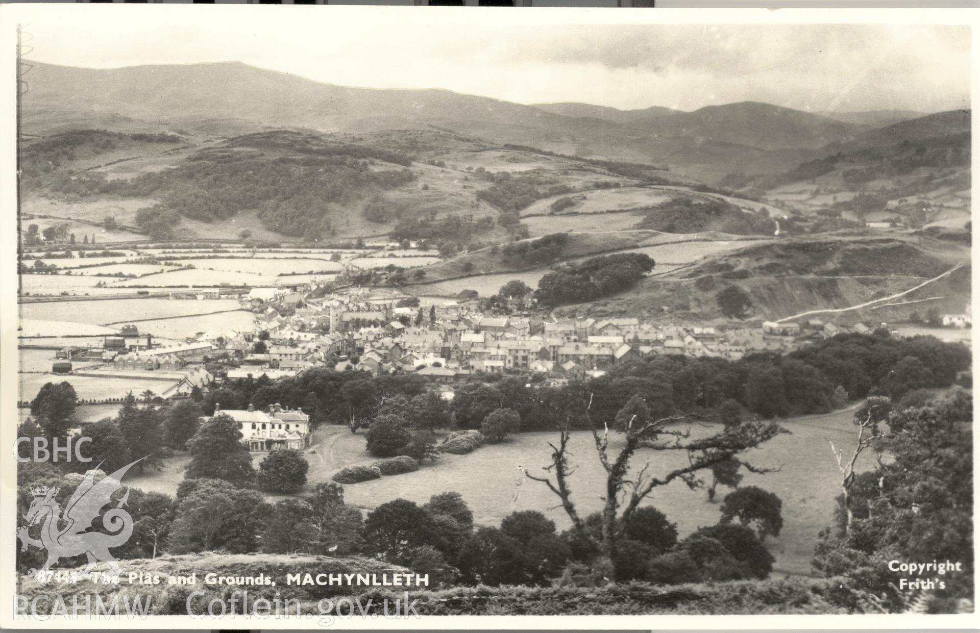 Digitised postcard image of Machynlleth town from high viewpoint above the Plas, Frith's Series. Produced by Parks and Gardens Data Services, from an original item in the Peter Davis Collection at Parks and Gardens UK. We hold only web-resolution images of this collection, suitable for viewing on screen and for research purposes only. We do not hold the original images, or publication quality scans.
