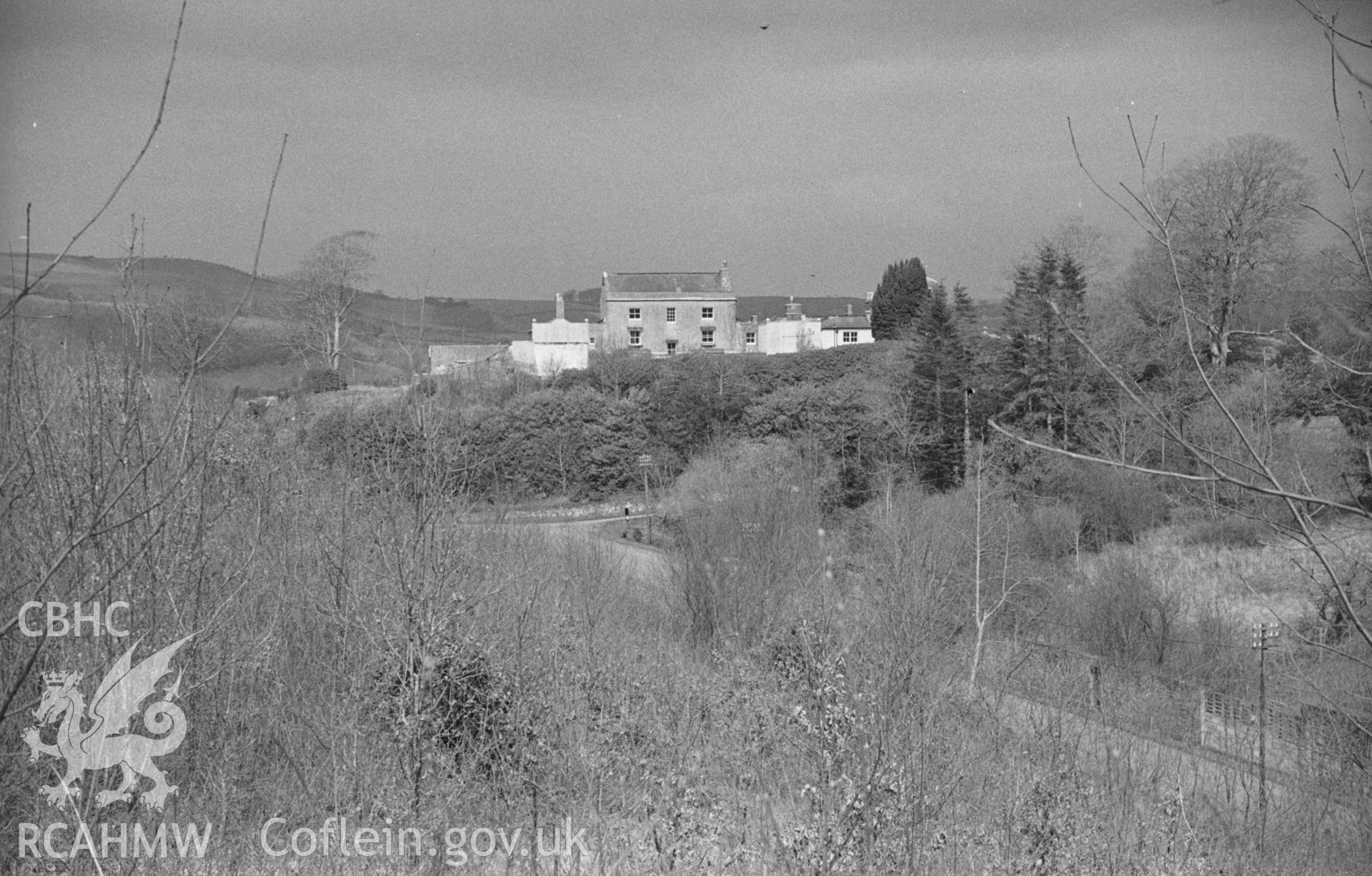 Black and White photograph showing Castle Hill, Llanilar, from the footpath across Nant Adal. Photographed by Arthur Chater in April 1962 from Grid Reference SN 624 746, looking north east.