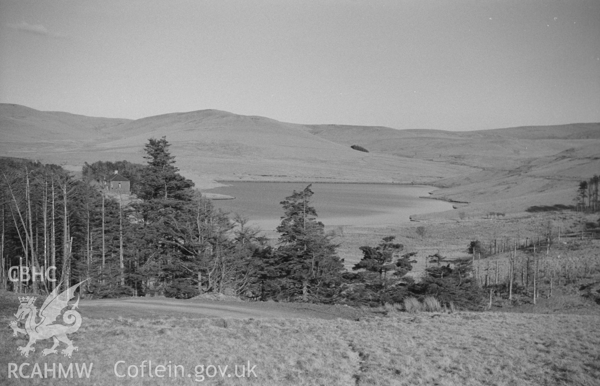 Black and White photograph showing Anglers Retreat and New Pool from the road to the west. Photographed by Arthur Chater in April 1962 from Grid Reference SN 743 923, looking east south east.