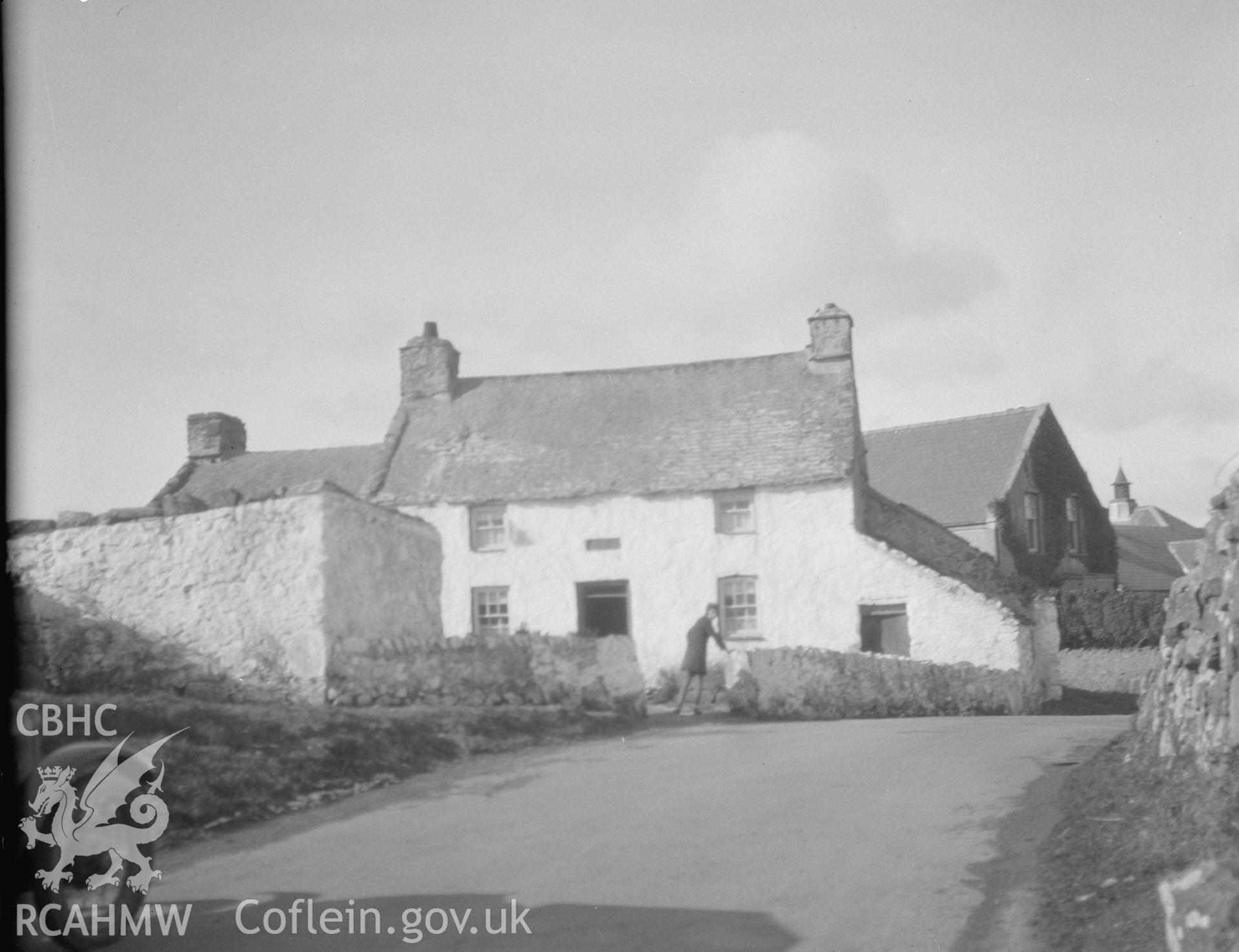 Black and white photograph of a cottage at Llandrygan.