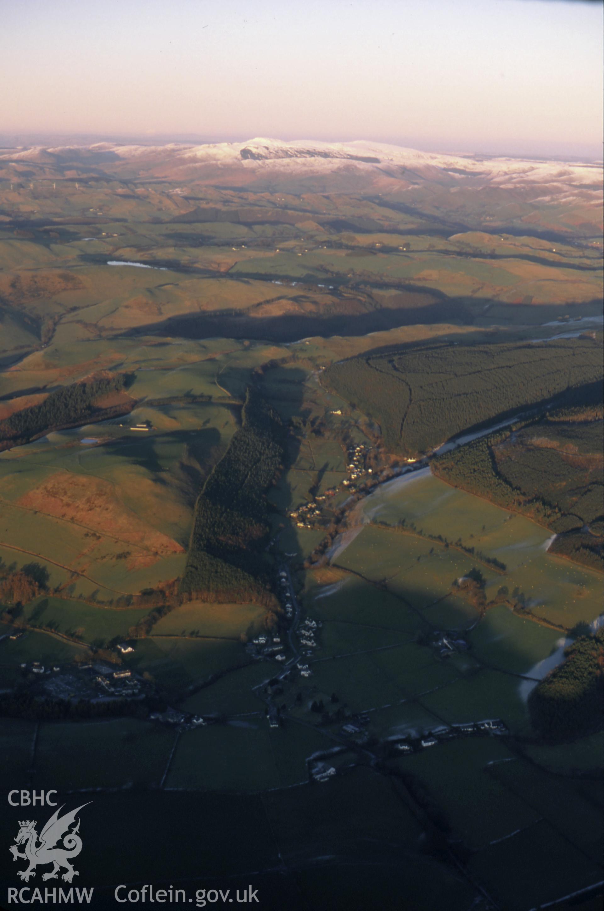 RCAHMW colour slide oblique aerial photograph of Llanafan, from the west, Trawsgoed, taken on 11/01/1999 by Toby Driver