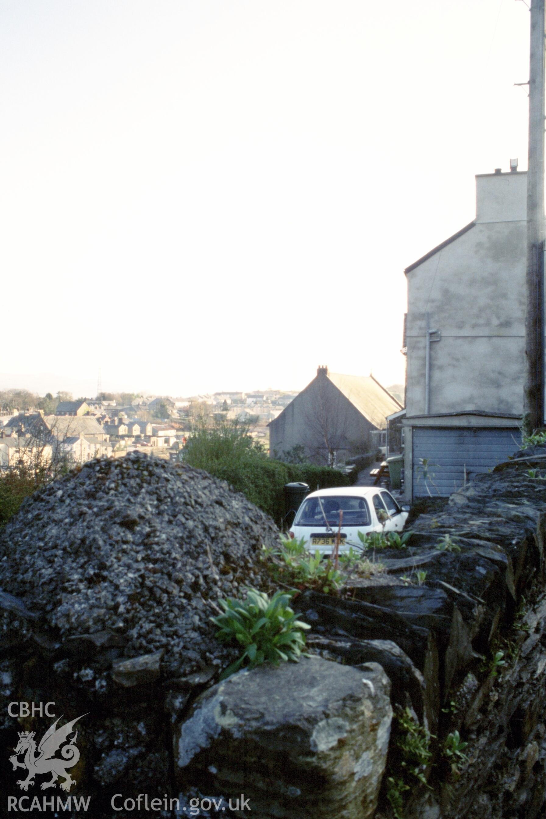 Exterior, rear gable, in middle distance.