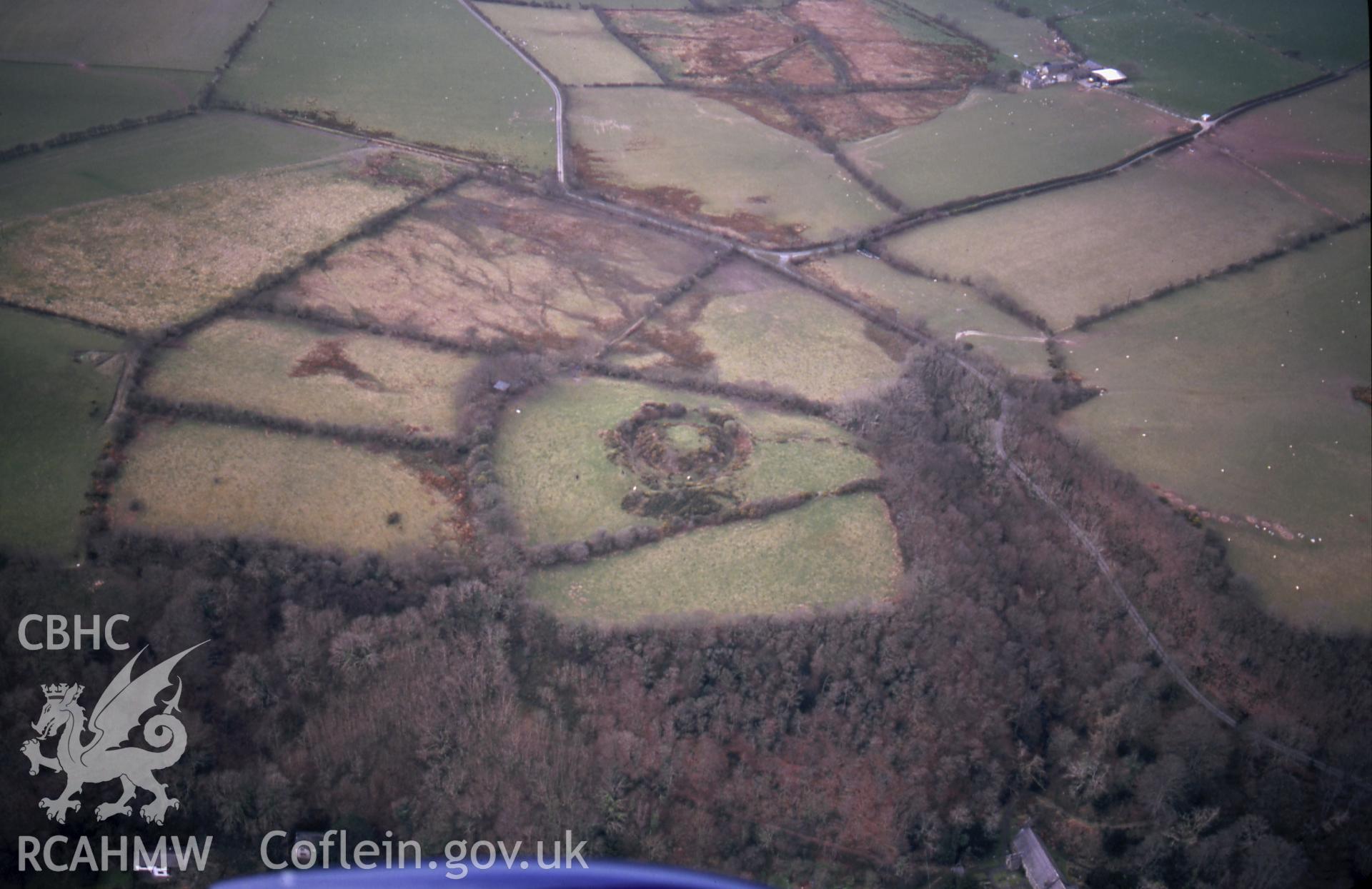 RCAHMW colour slide oblique aerial photograph of Castell Gwallter, Llandre, Geneu'r Glyn, taken on 19/03/1999 by Toby Driver