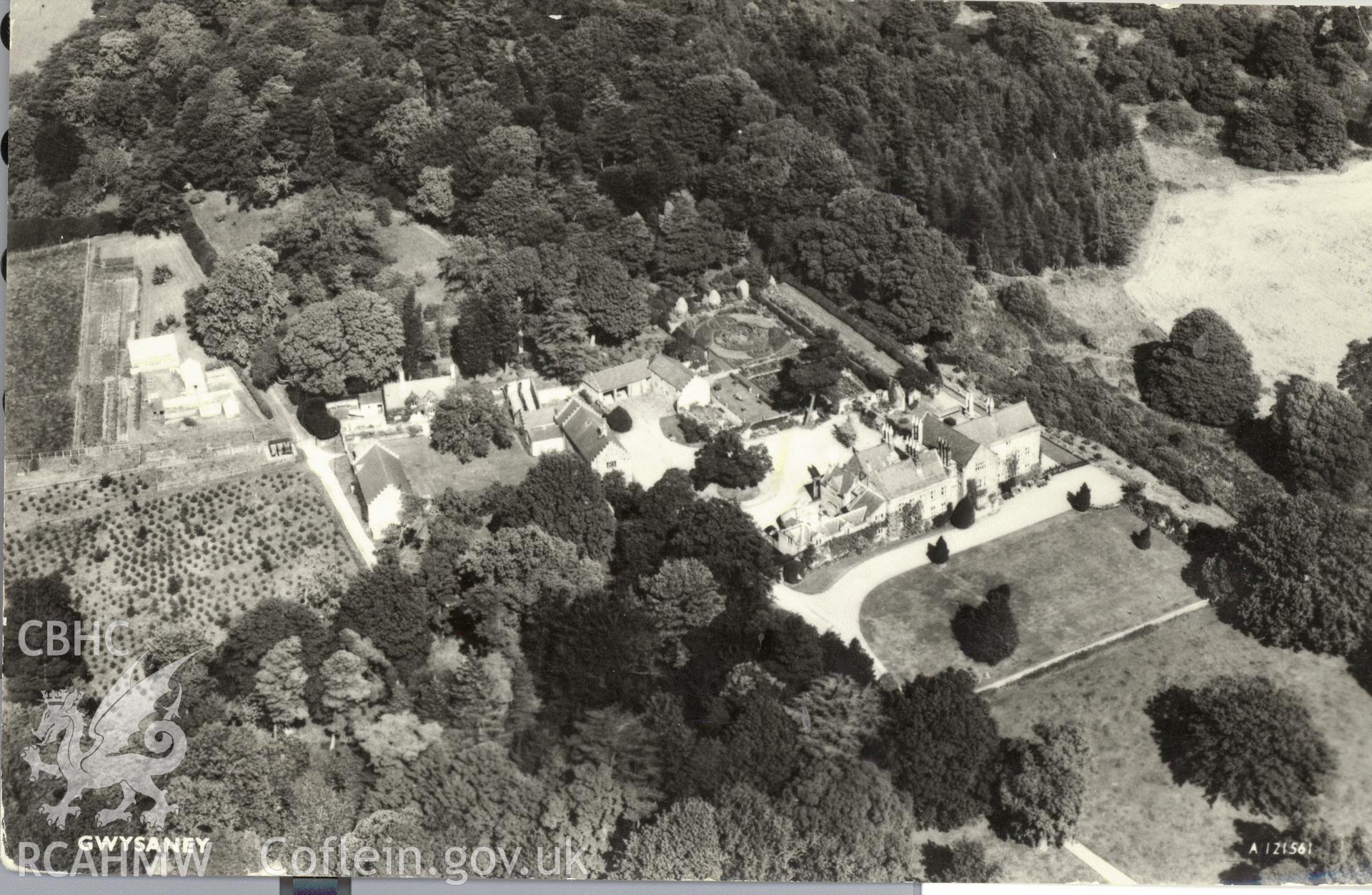 Digitised postcard image of aerial view of Gwysaney Hall, Aero Films and Aero Pictorial Ltd., Elstree way, Boreham Wood, Herts. Produced by Parks and Gardens Data Services, from an original item in the Peter Davis Collection at Parks and Gardens UK. We hold only web-resolution images of this collection, suitable for viewing on screen and for research purposes only. We do not hold the original images, or publication quality scans.