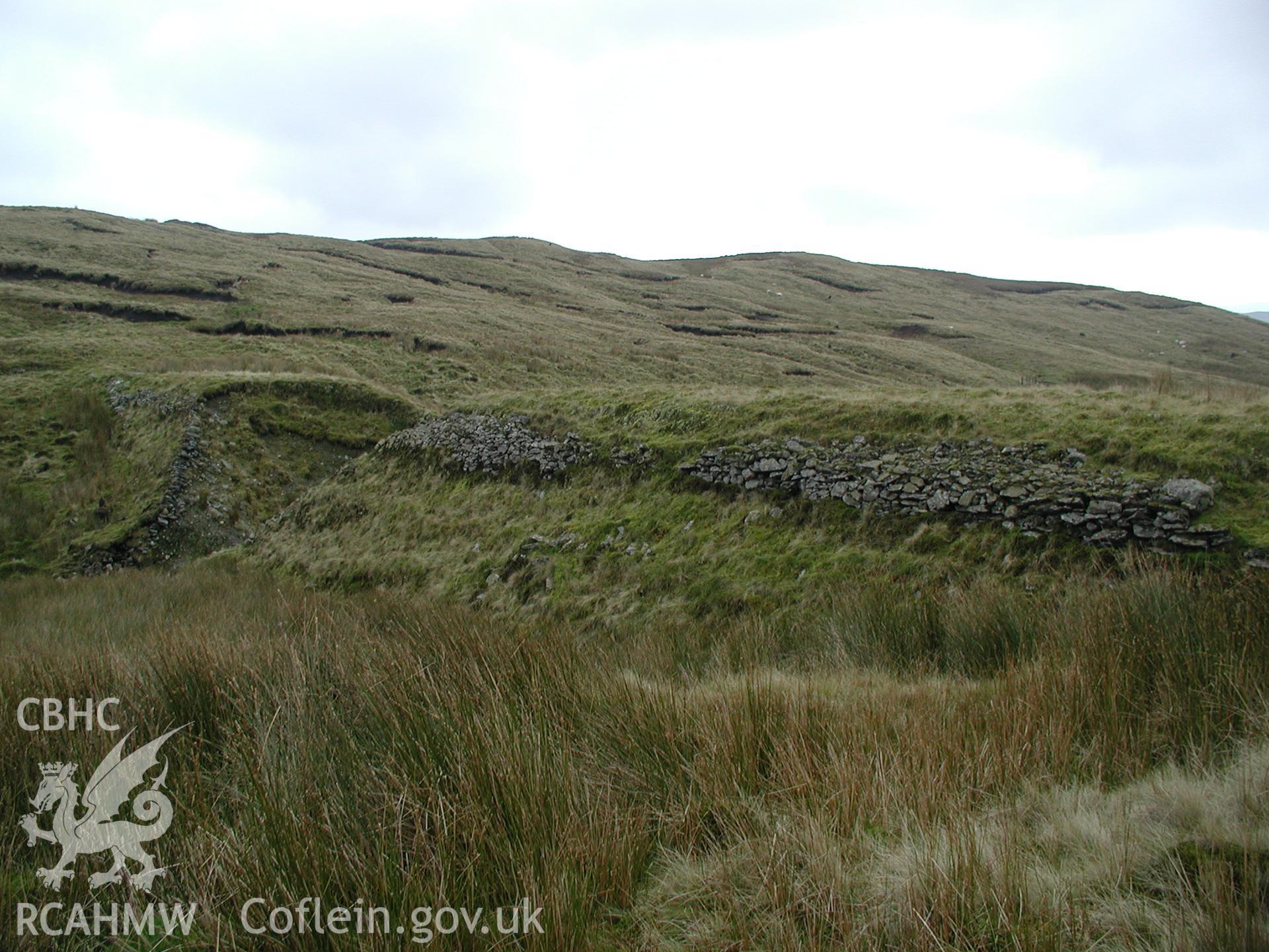 Photograph of Plynlimon Lead Mine Dam taken on 02/11/2004 by R.S. Jones during an Upland Survey undertaken by Cambrian Archaeological Projects.