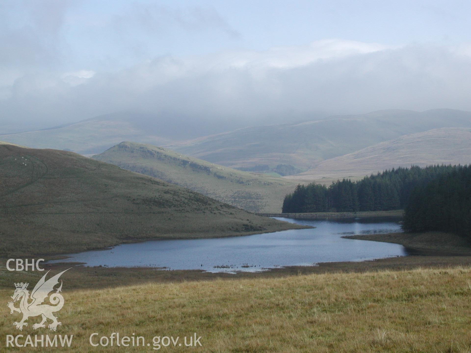 Photograph of Bog Pond Reservoir taken on 01/11/2004 by R.S. Jones during an Upland Survey undertaken by Cambrian Archaeological Projects.