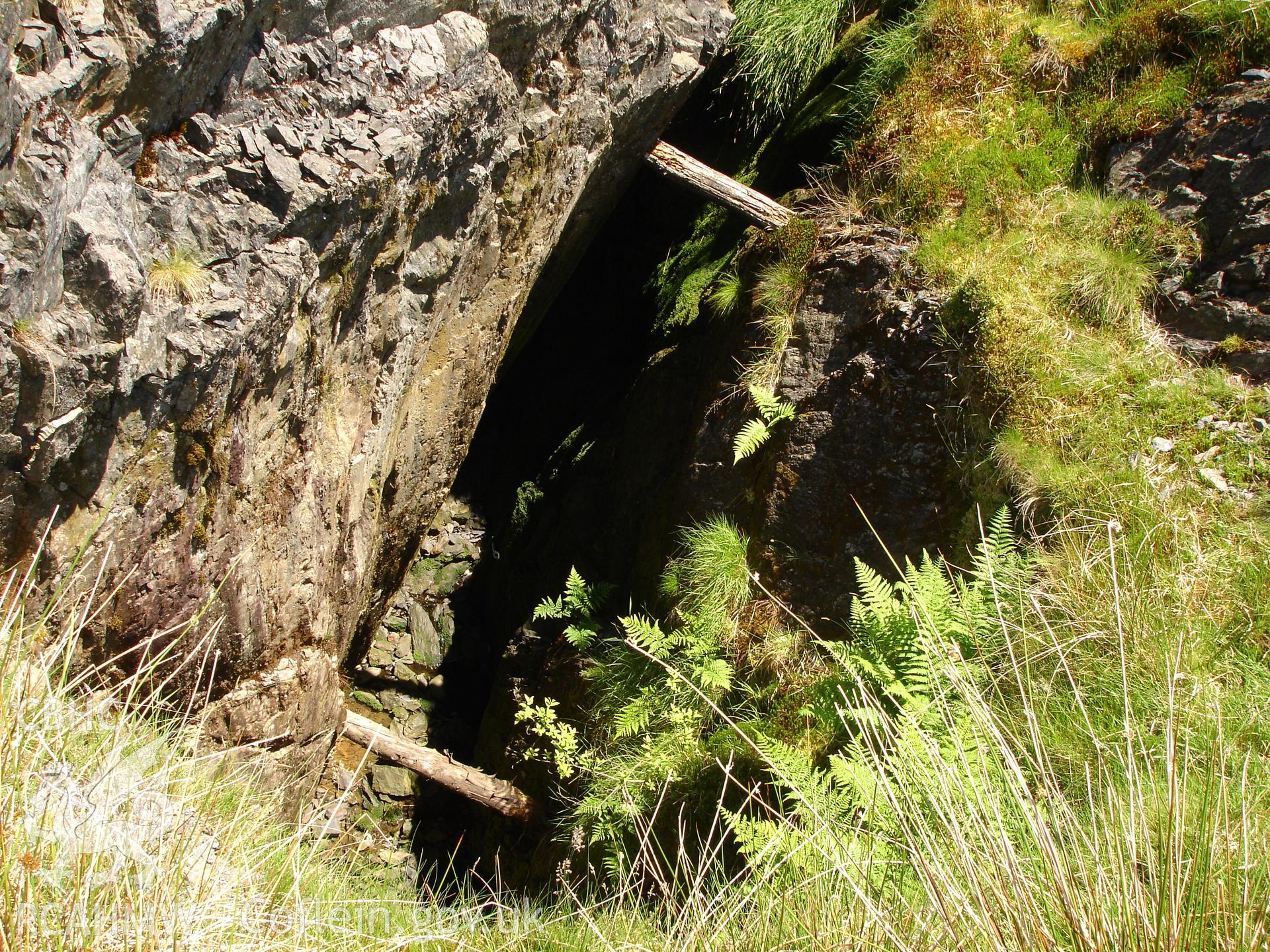 Photograph of Camdwr Bach Lead Mine Stope taken on 23/06/2005 by R.P. Sambrook during an Upland Survey undertaken by Trysor Archaeology.