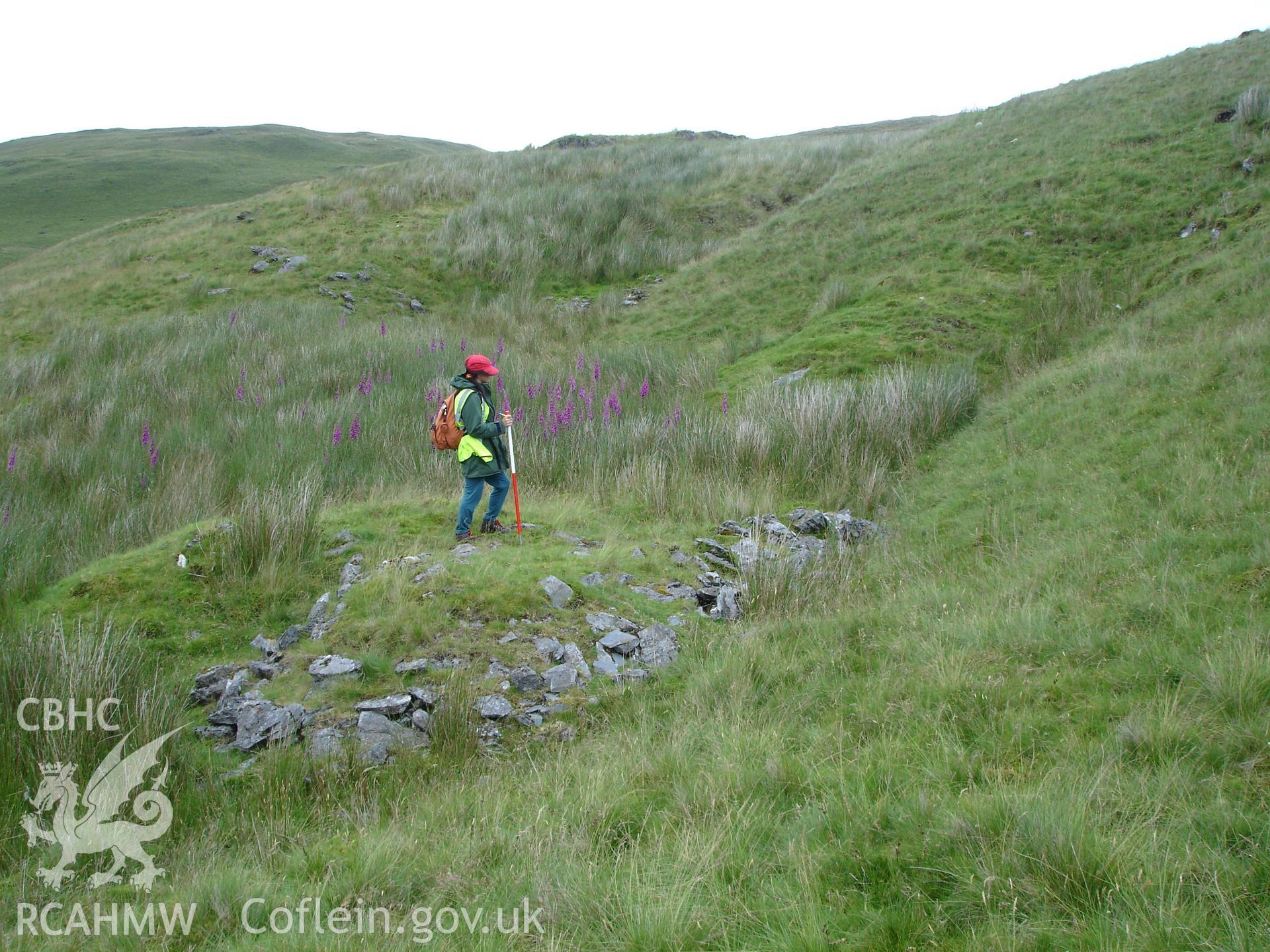 Photograph of Hyddgen Lead Mine Spoil Tip XI taken on 06/07/2005 by R.P. Sambrook during an Upland Survey undertaken by Trysor Archaeology.