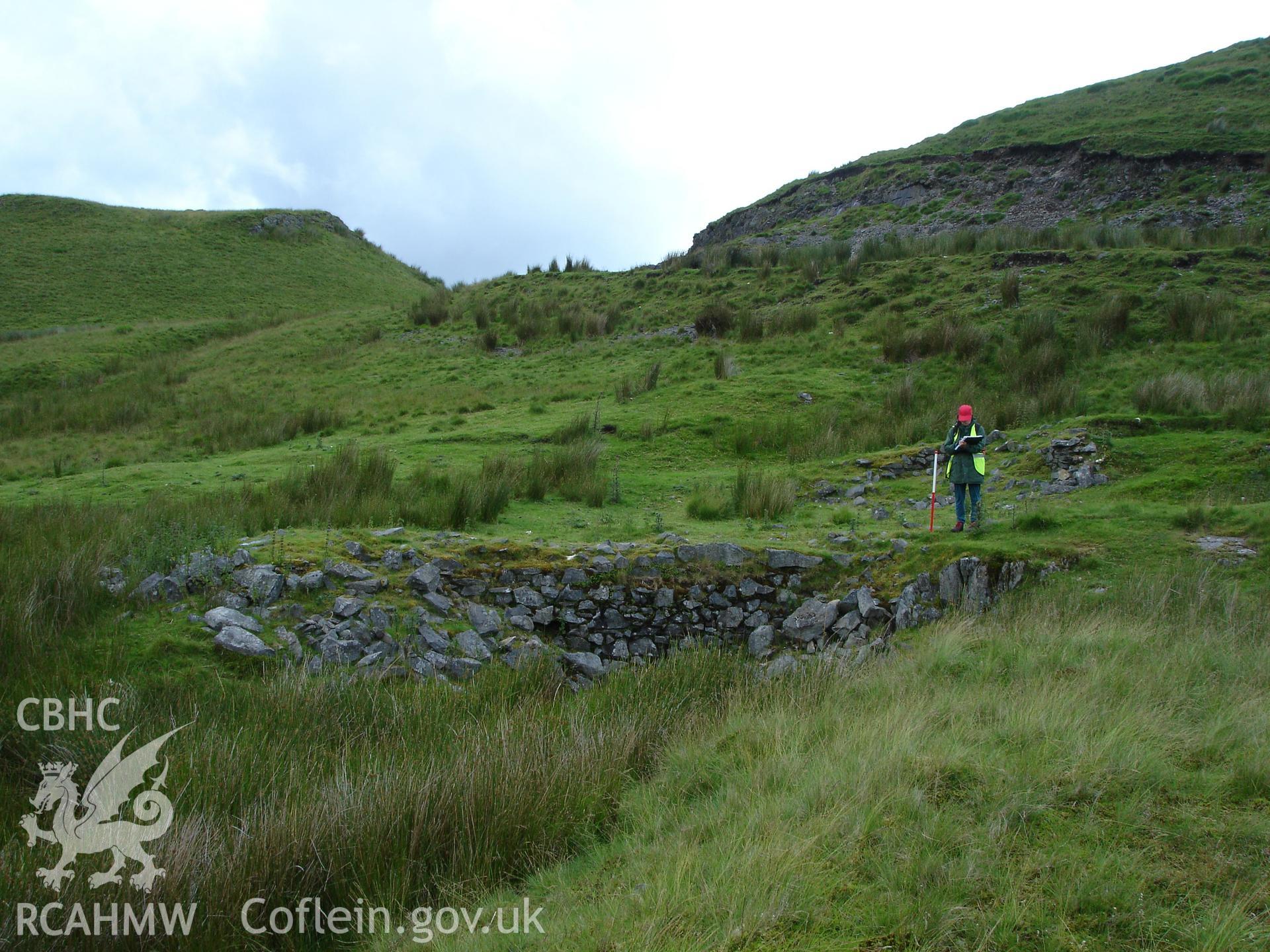 Photograph of Hyddgen Lead Mine Wheel Pit I taken on 06/07/2005 by R.P. Sambrook during an Upland Survey undertaken by Trysor Archaeology.