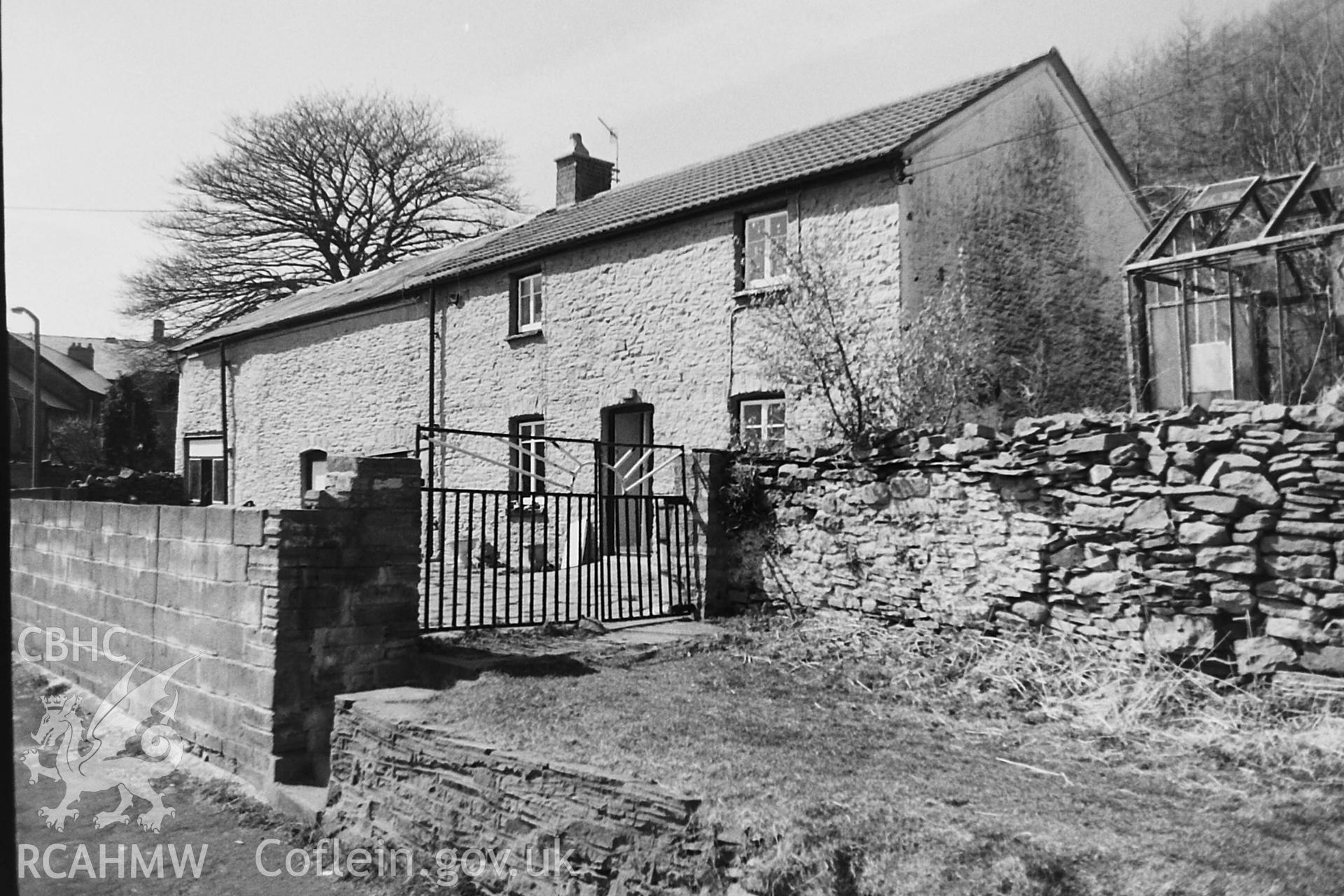 Black and white photo showing exterior view of Ffynnon Dwym, taken by Paul R. Davis, 1984.