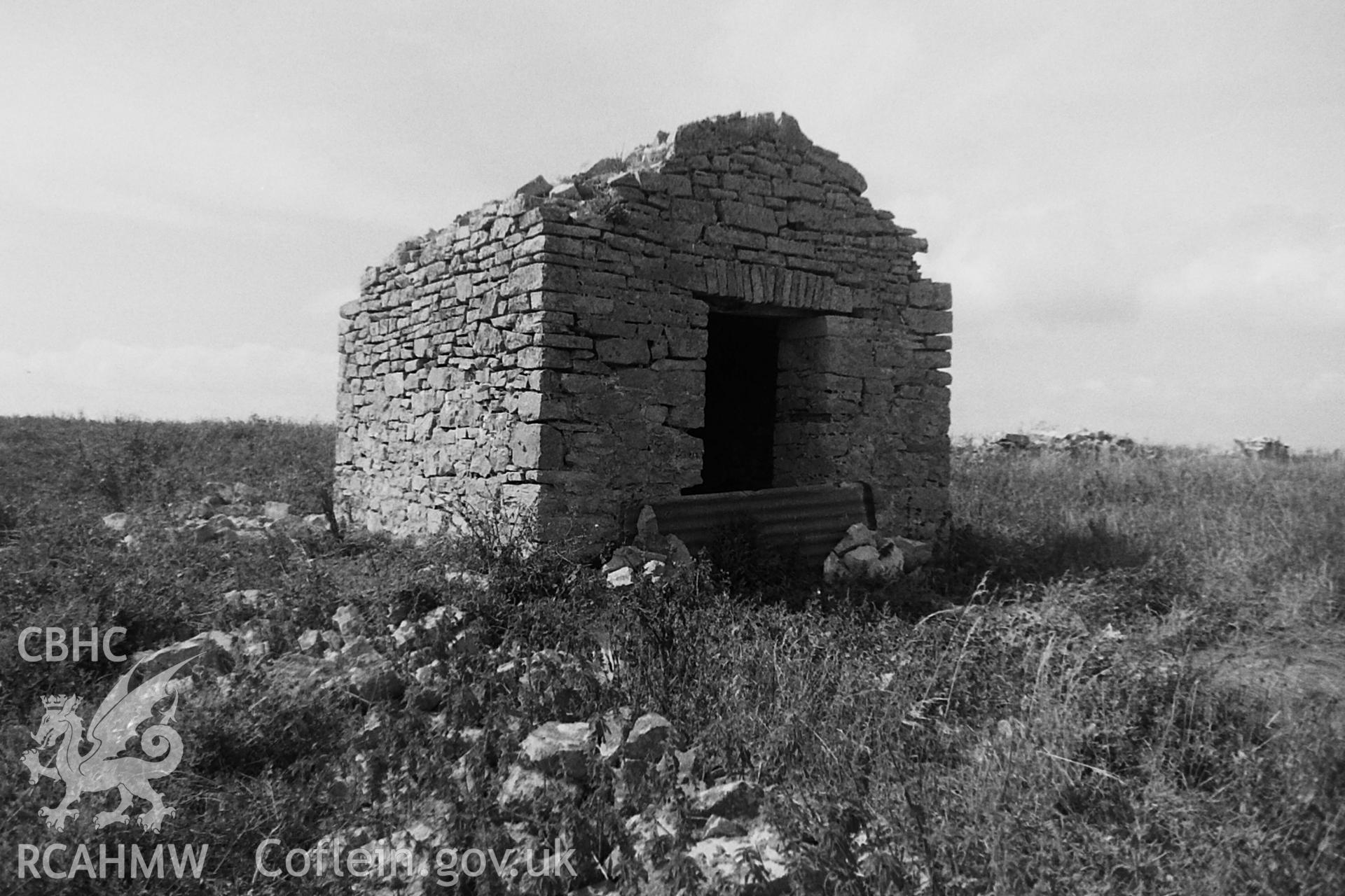 Black and white photo showing ruins on St Margaret's Isle, taken by Paul R. Davis, 1984.