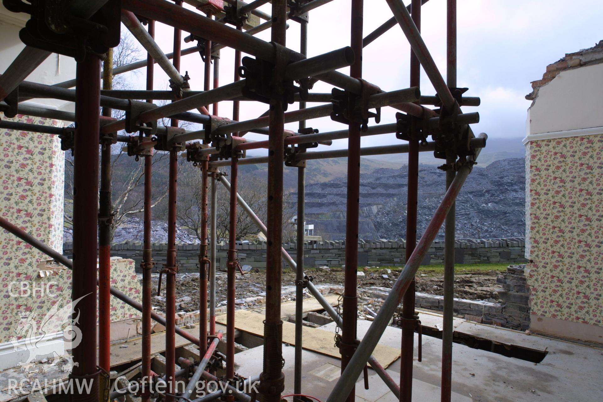 Digital colour photograph showing rennovation work in a room at Penrhyn Quarry Offices. The photograph also shows part of a missing exterior wall.