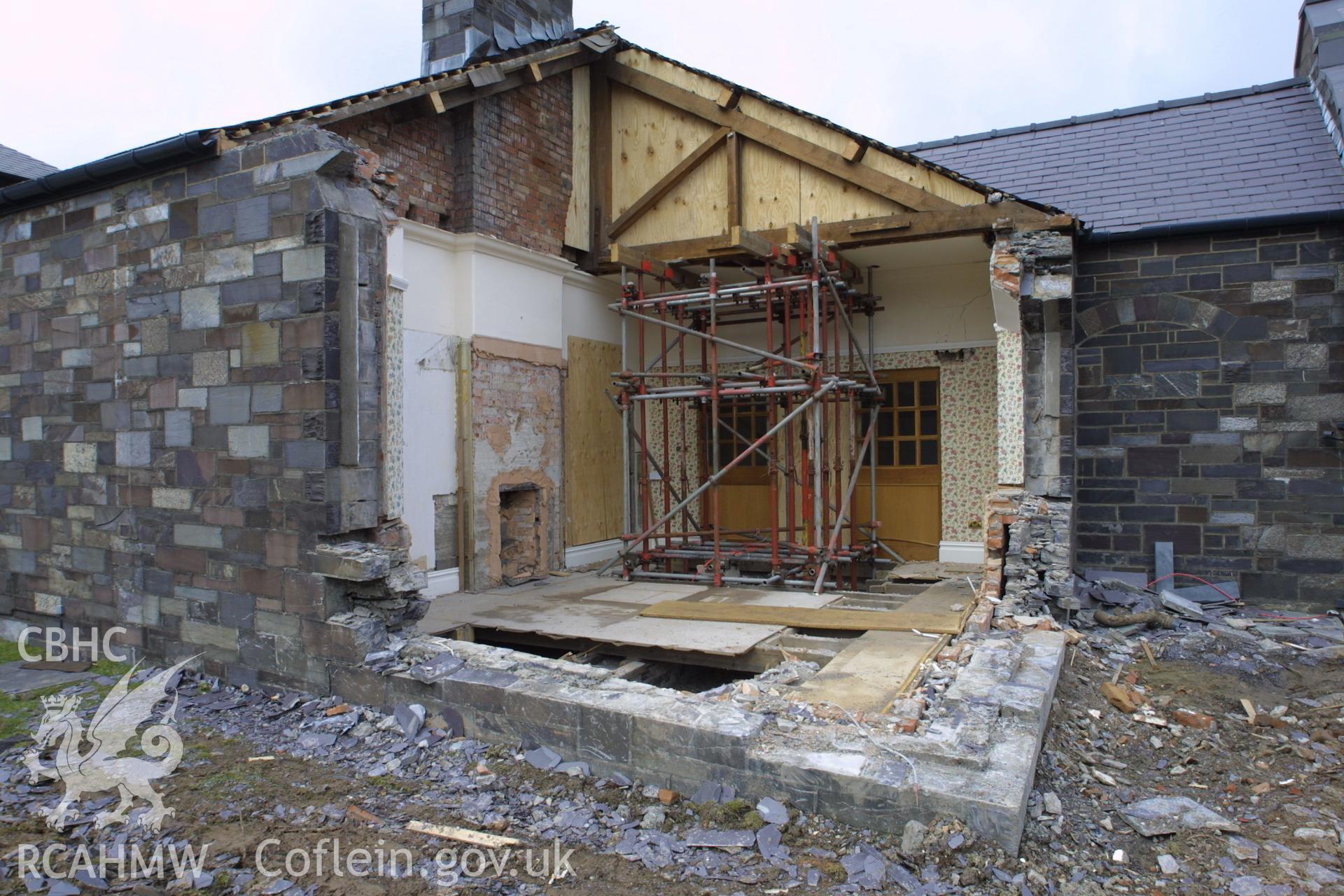 Digital colour photograph showing rennovation work in a room at Penrhyn Quarry Offices. The photograph also shows part of a missing exterior wall.