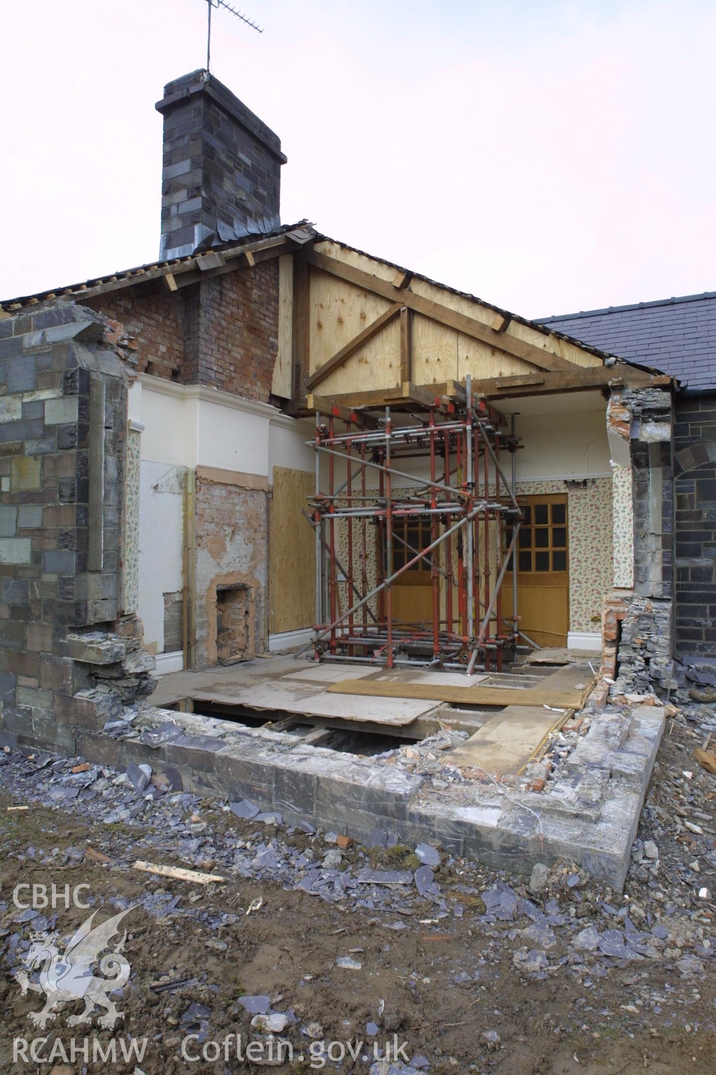 Digital colour photograph showing rennovation work in a room at Penrhyn Quarry Offices. The photograph also shows part of a missing exterior wall.