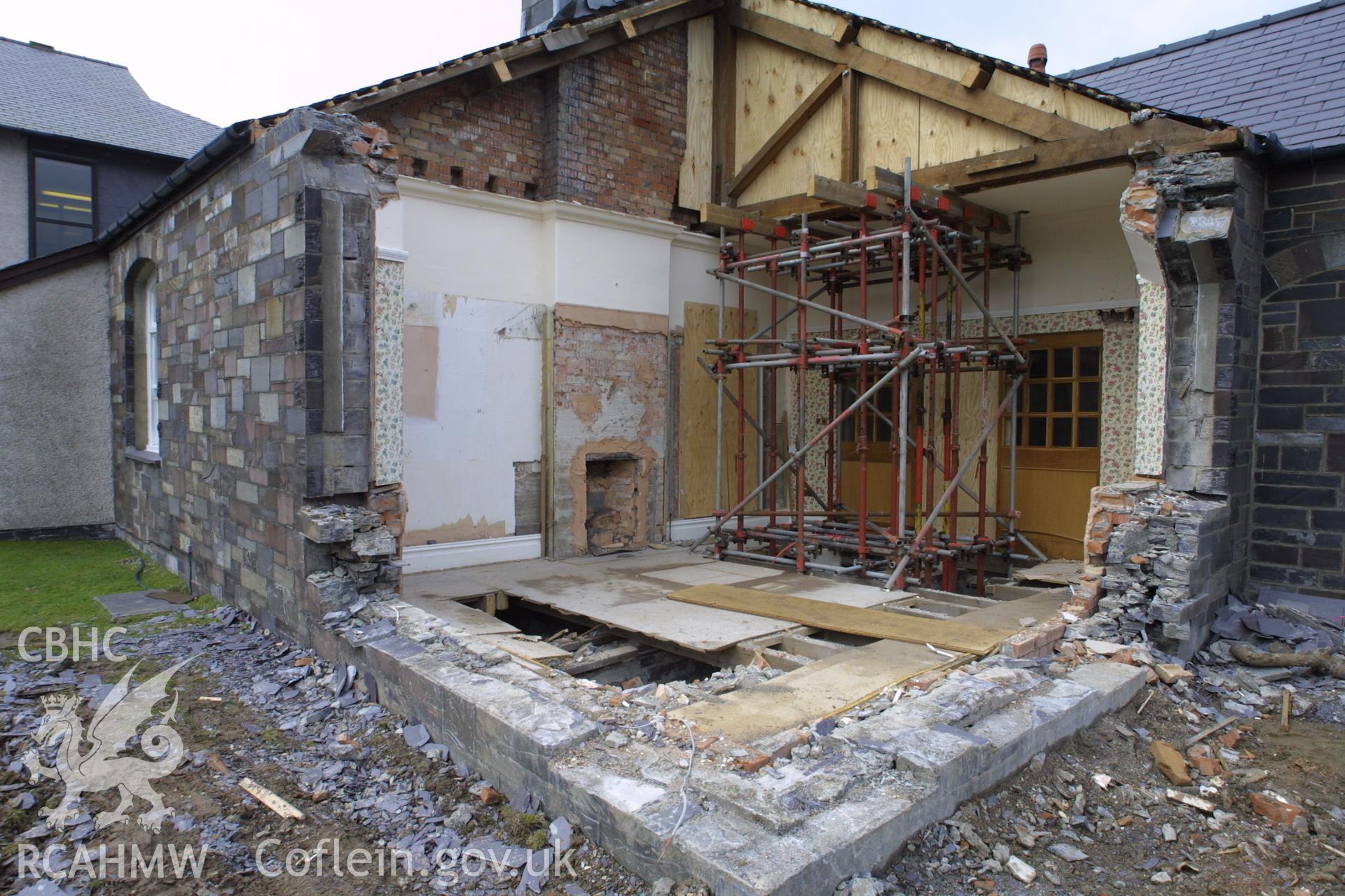 Digital colour photograph showing rennovation work in a room at Penrhyn Quarry Offices. The photograph also shows part of a missing exterior wall.