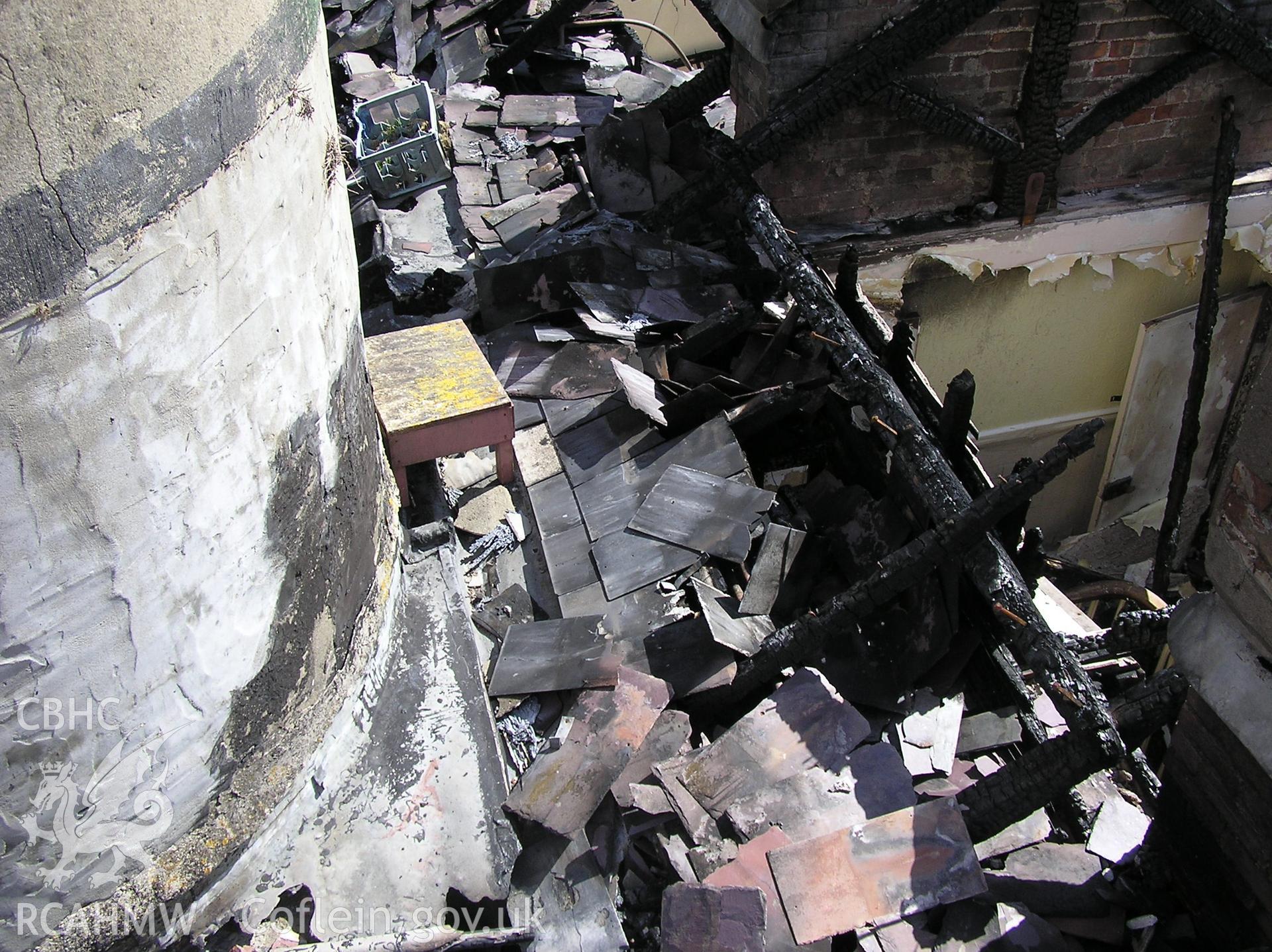 Colour digital photograph showing part of the wreckage of the Royal Gatehouse Hotel.