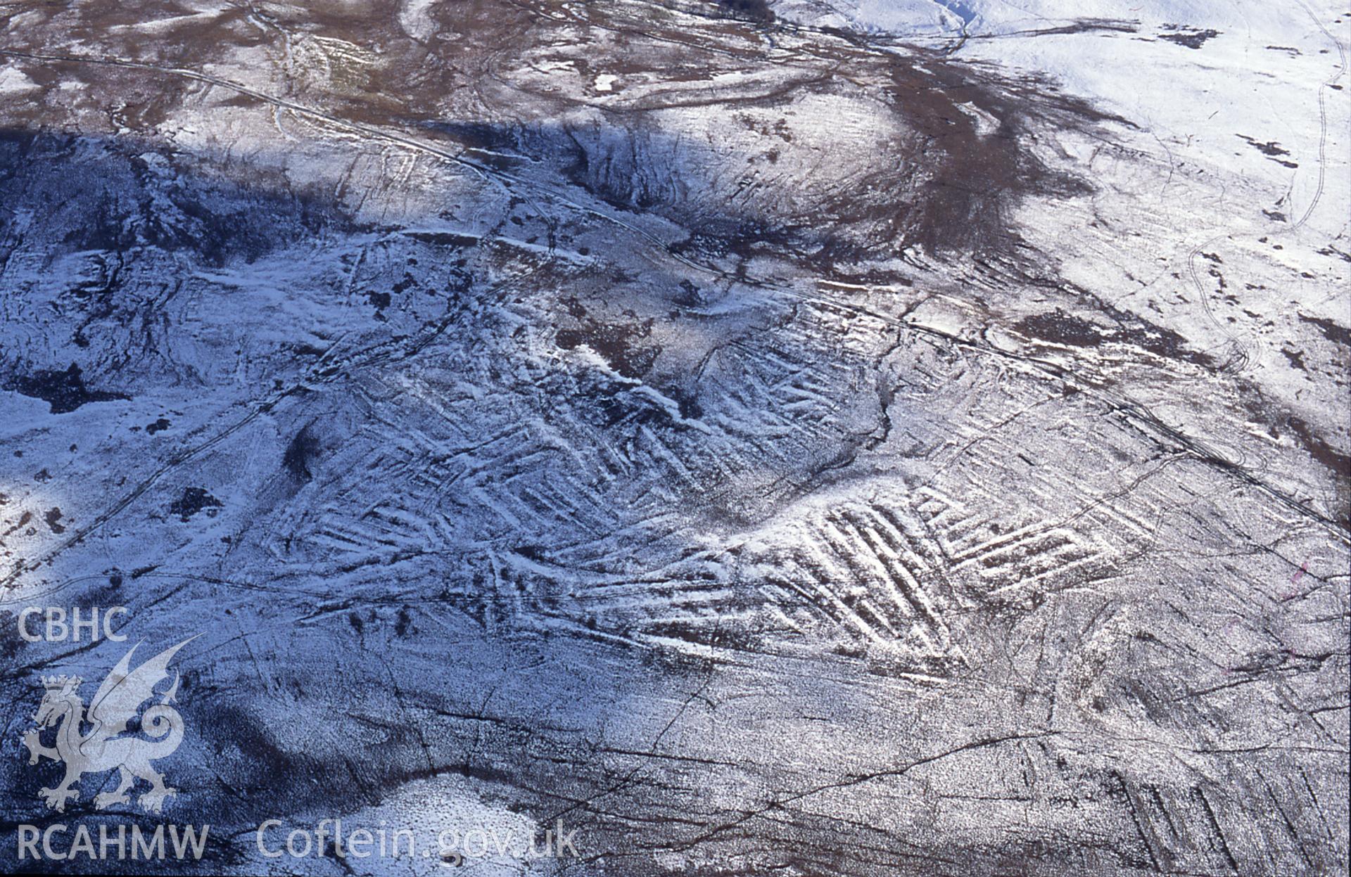 RCAHMW colour slide oblique aerial photograph of area of peat-cutting at Rhos Saith-maen, Llanwrthwl, taken by C.R. Musson on the 28/02/1996.