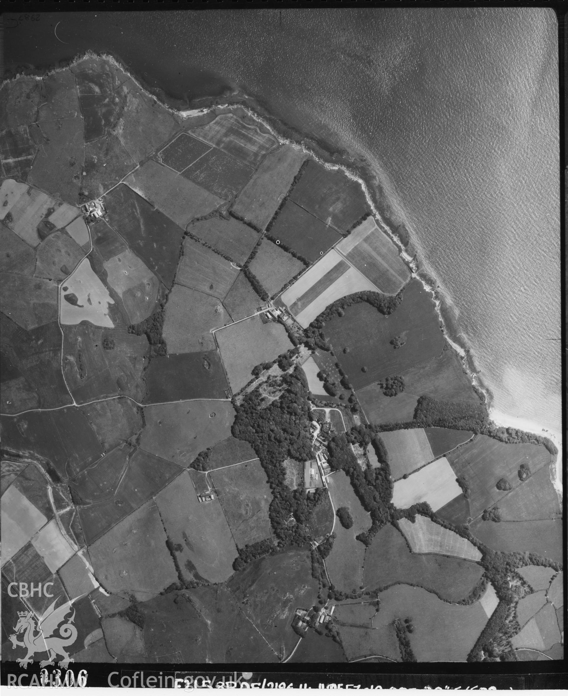 Black and white vertical aerial photograph taken by the RAF on 14/06/1957 centred on SH47439014 at a scale of 1:10000. The photograph includes part of Llaneilian community on the Isle of Anglesey.