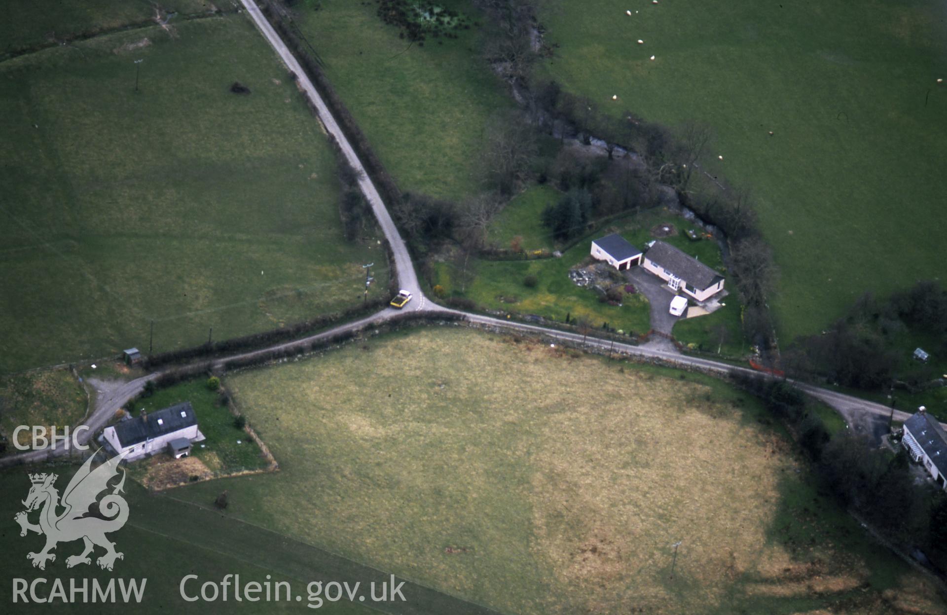 RCAHMW colour slide oblique aerial photograph of Ty Dafydd, Brogynin, Trefeurig, taken on 19/03/1999 by Toby Driver