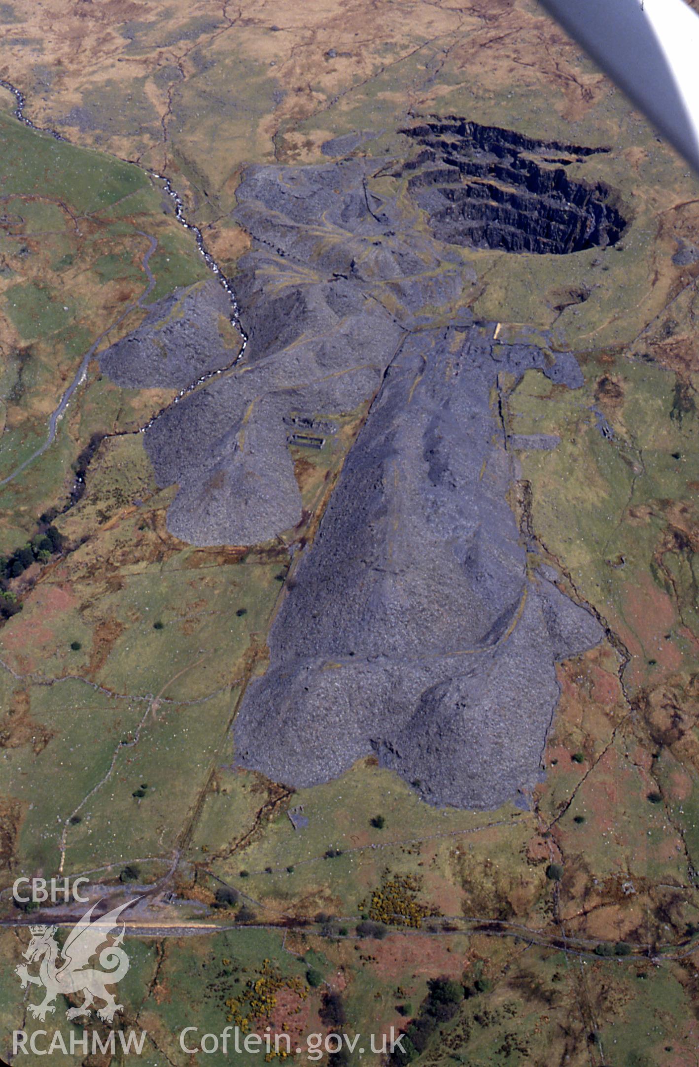 RCAHMW colour slide oblique aerial photograph of Glanafon Quarry, Capel Garmon, Betws Garmon, taken by C.R. Musson, 02/05/94