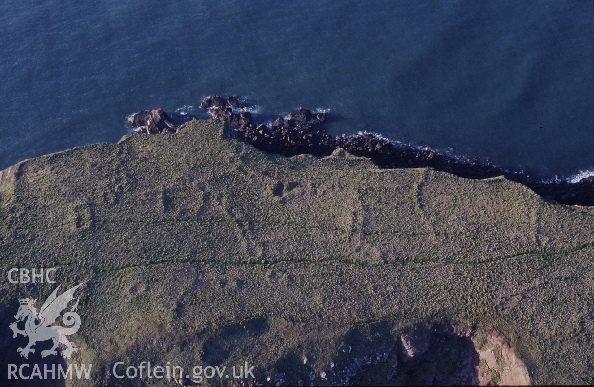 RCAHMW colour slide oblique aerial photograph of Gateholm Island, Marloes And St Brides, taken by C.R.Musson on the 27/02/1996