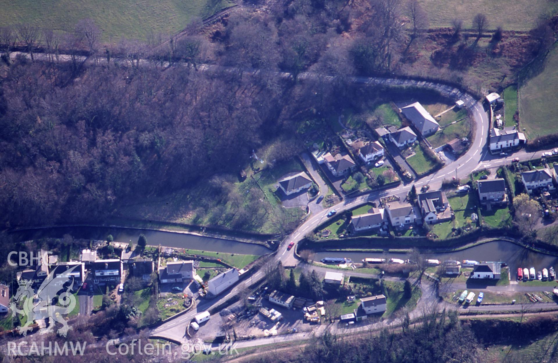 RCAHMW colour slide oblique aerial photograph of the railway crossing and canal, Govilon, Llanfoist Fawr, taken on 15/03/1999 by Toby Driver