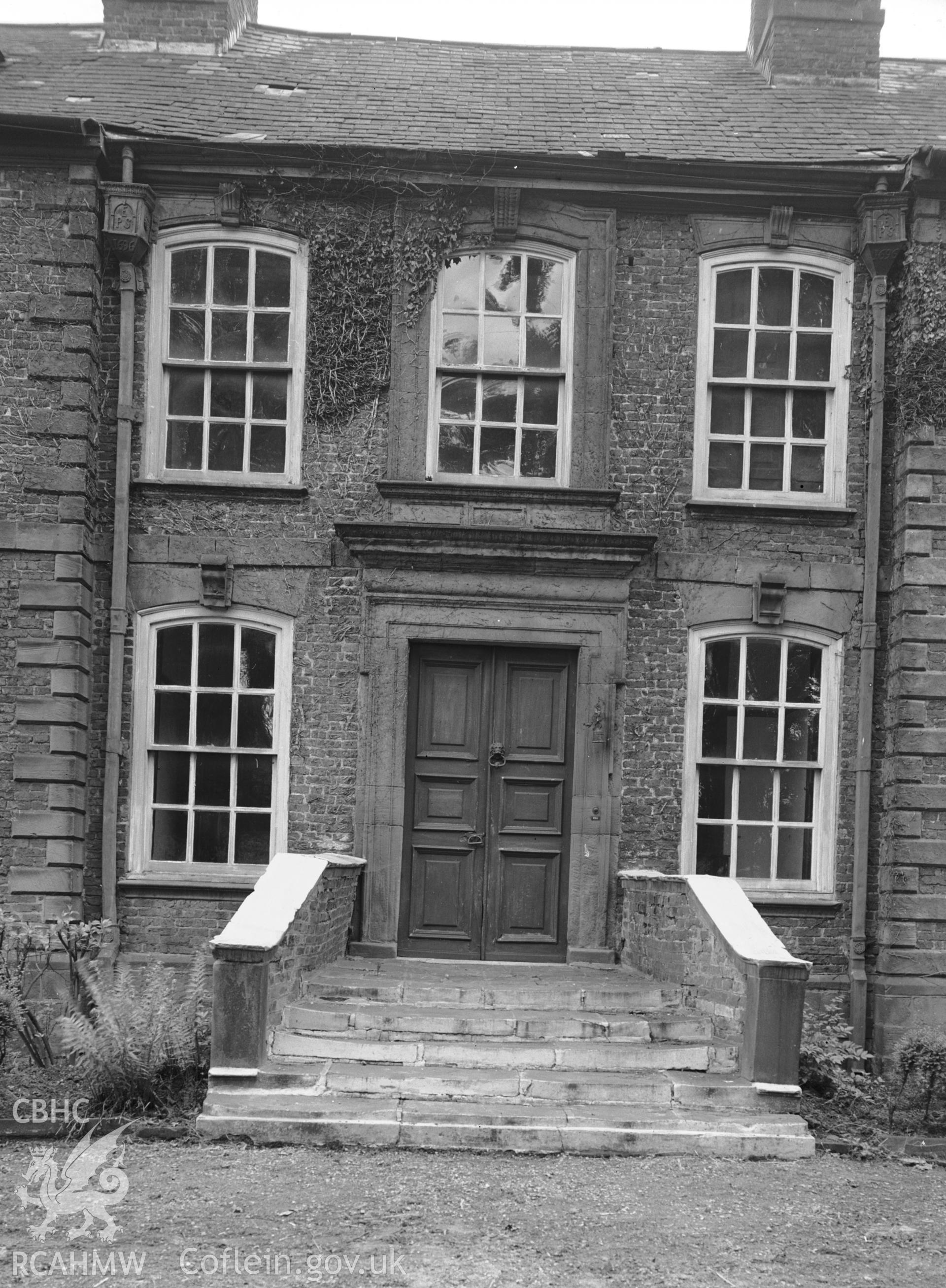 Exterior: W elevation, detail of door and windows