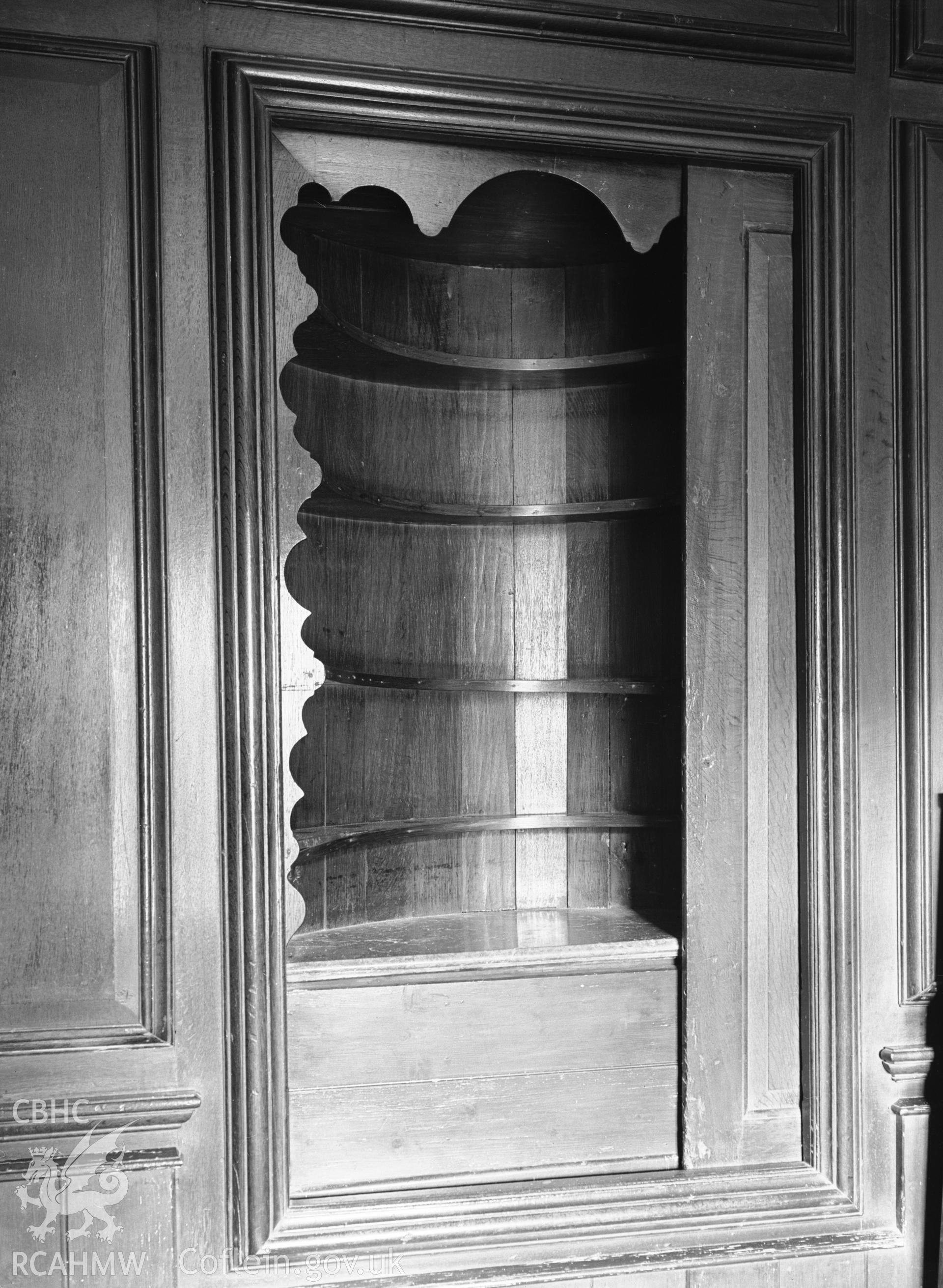 Wine cupboard behind sliding panel