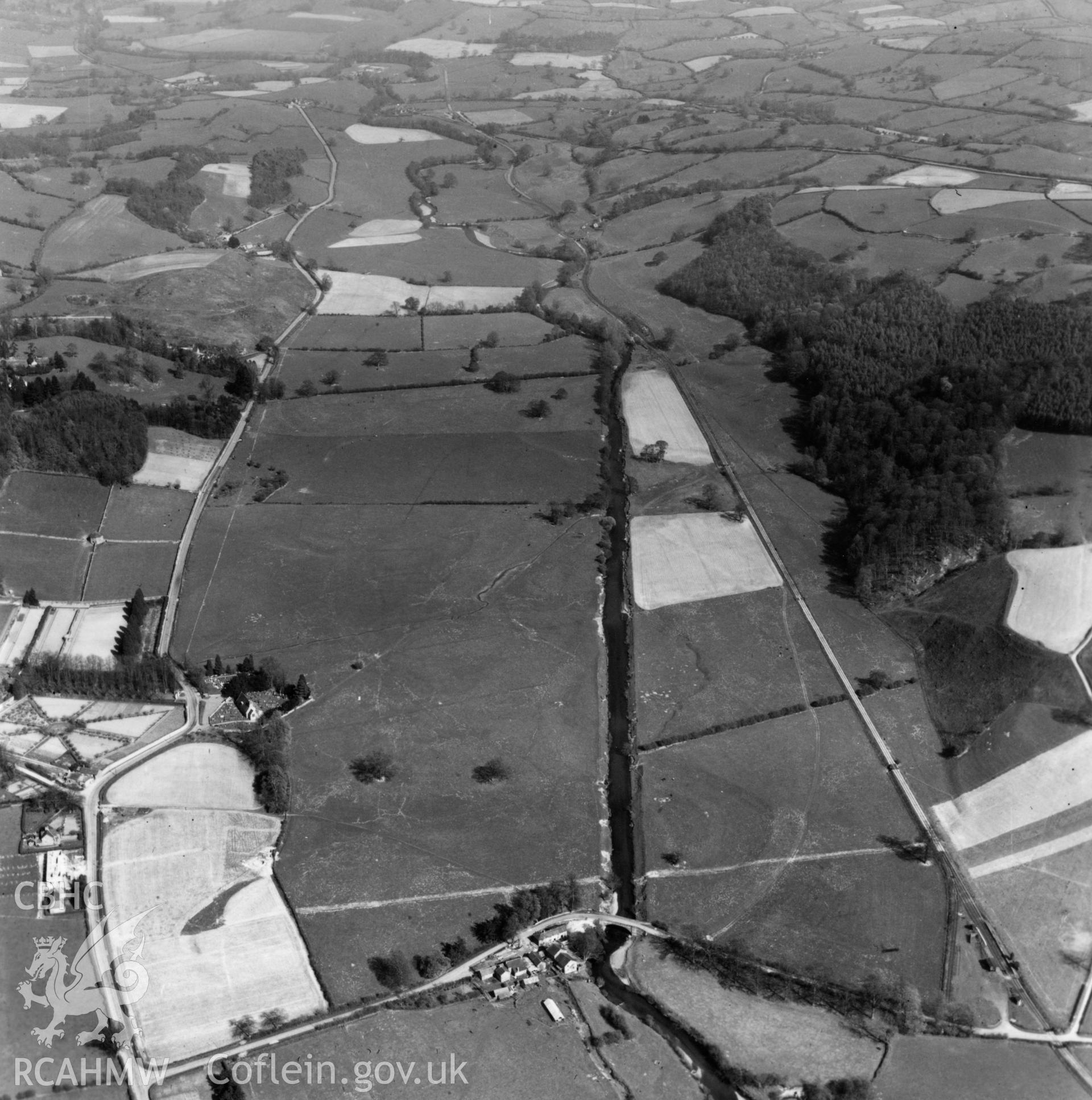 View of the Tanat valley showing railway, Llangedwyn Hall garden and Llangedwyn Bridge. Oblique aerial photograph.