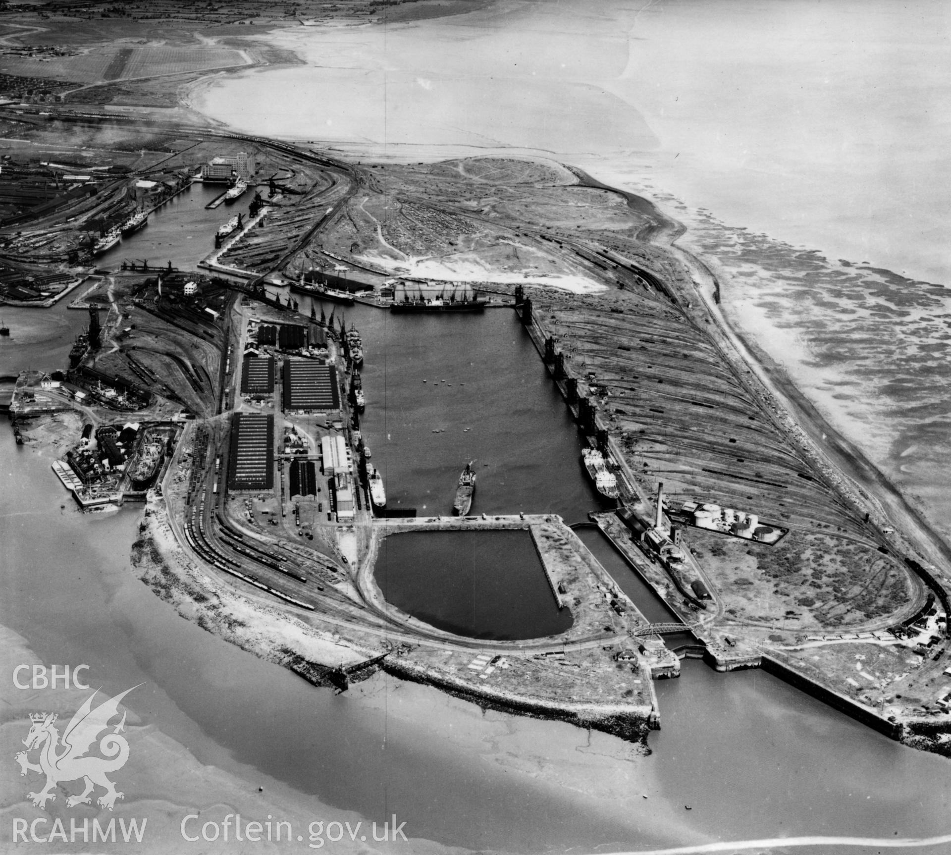 View of Cardiff docks from the south with Queen Alexandra dock in the foreground. Oblique aerial photograph, 5?" cut roll film.