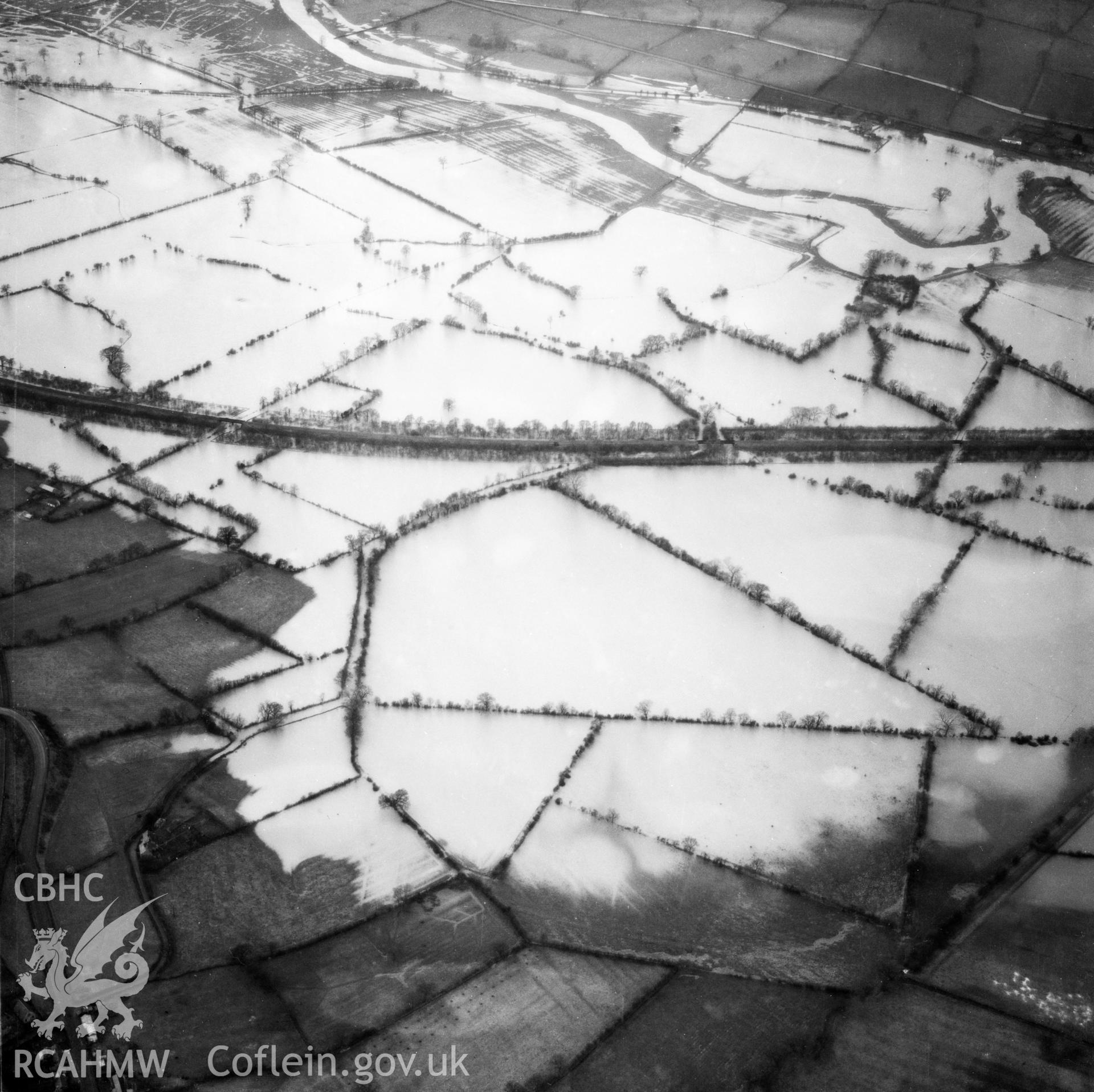 View of the river Severn in flood in the Criggion and Breiddan Hill area. Oblique aerial photograph, 5?" cut roll film.