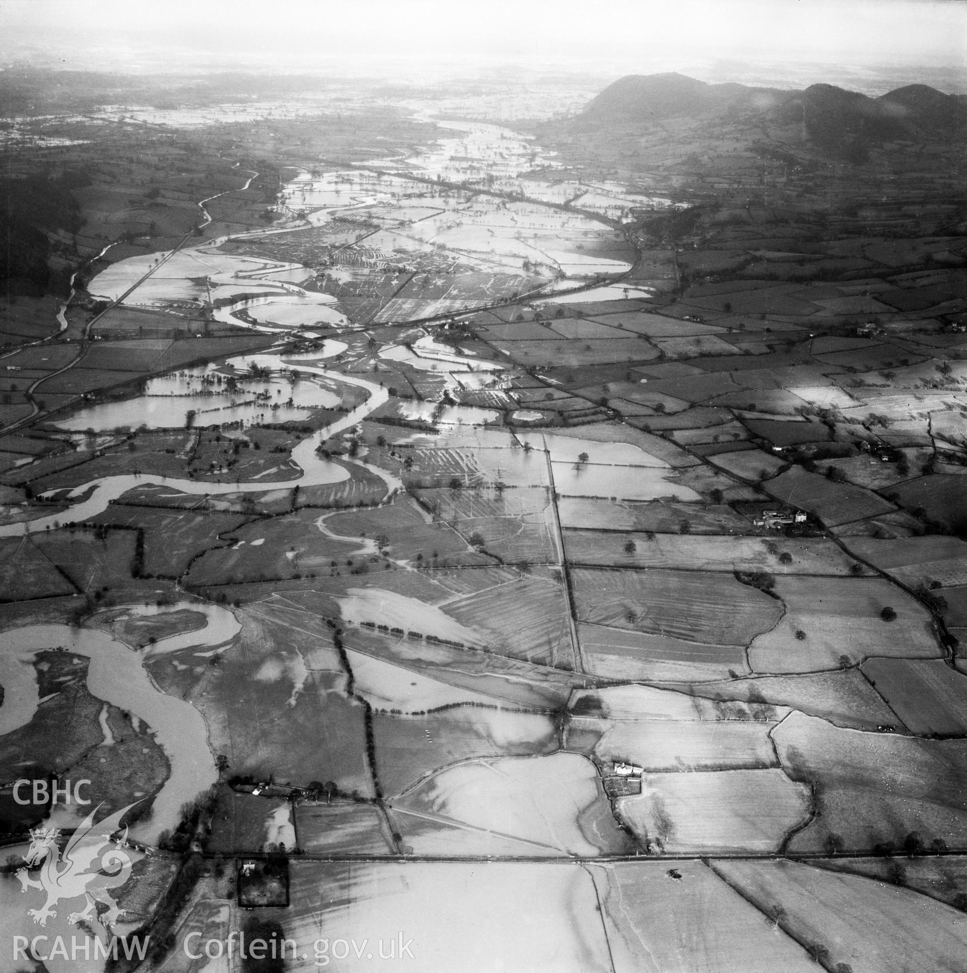 View of the river Severn in flood in the Criggion and Breiddan Hill area. Oblique aerial photograph, 5?" cut roll film.