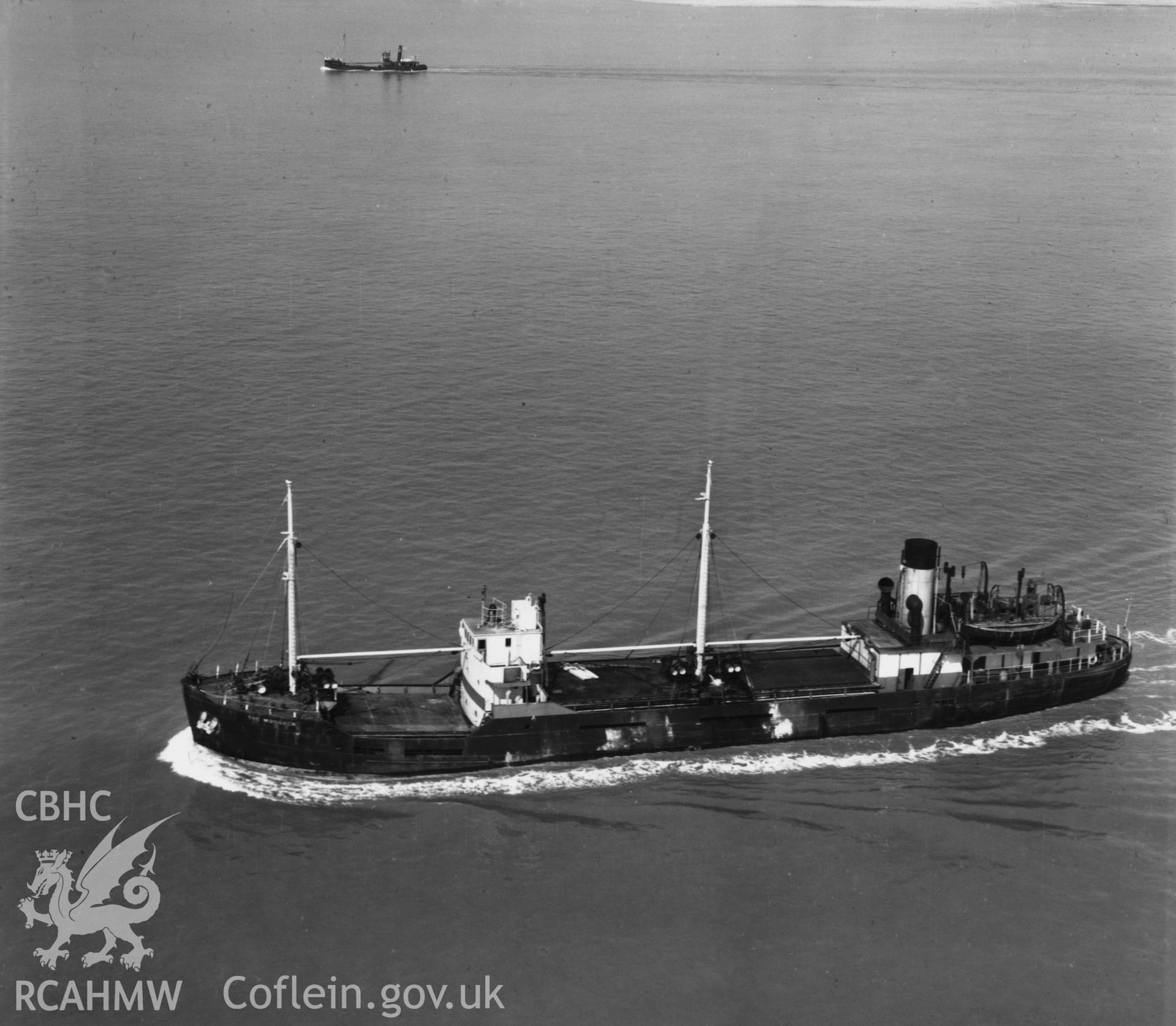 Close view of cargo ship in the Bristol Channel (Monarch). Oblique aerial photograph, 5?" cut roll film.