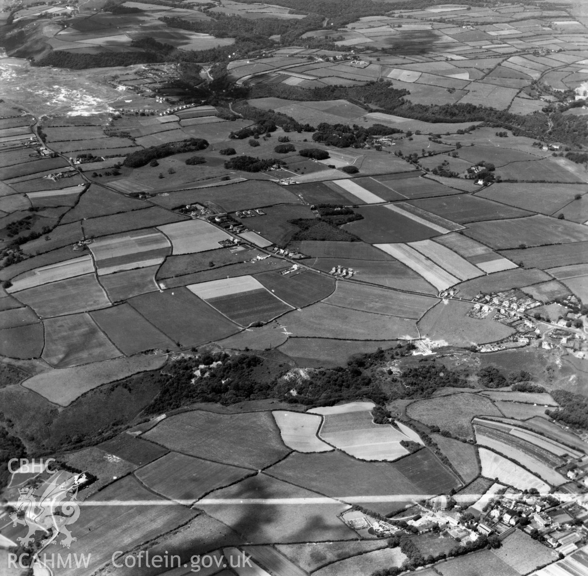 View down the Bishopston valley toward Pennard Burrows. Oblique aerial photograph, 5?" cut roll film.