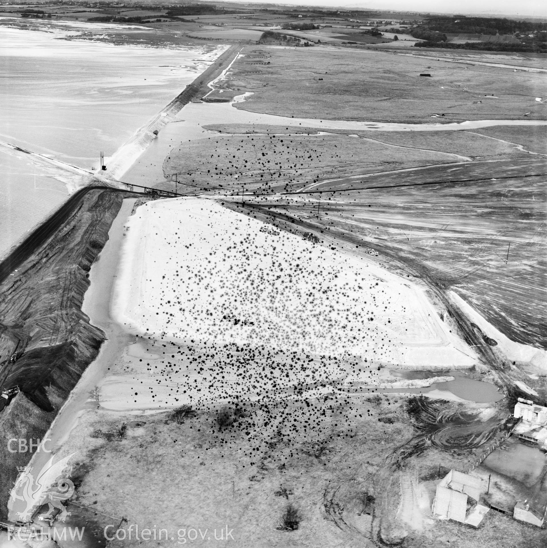 View of the dredging of the Shotton steelworks site (commissioned by Westminster Dredging Co.). Oblique aerial photograph, 5?" cut roll film.