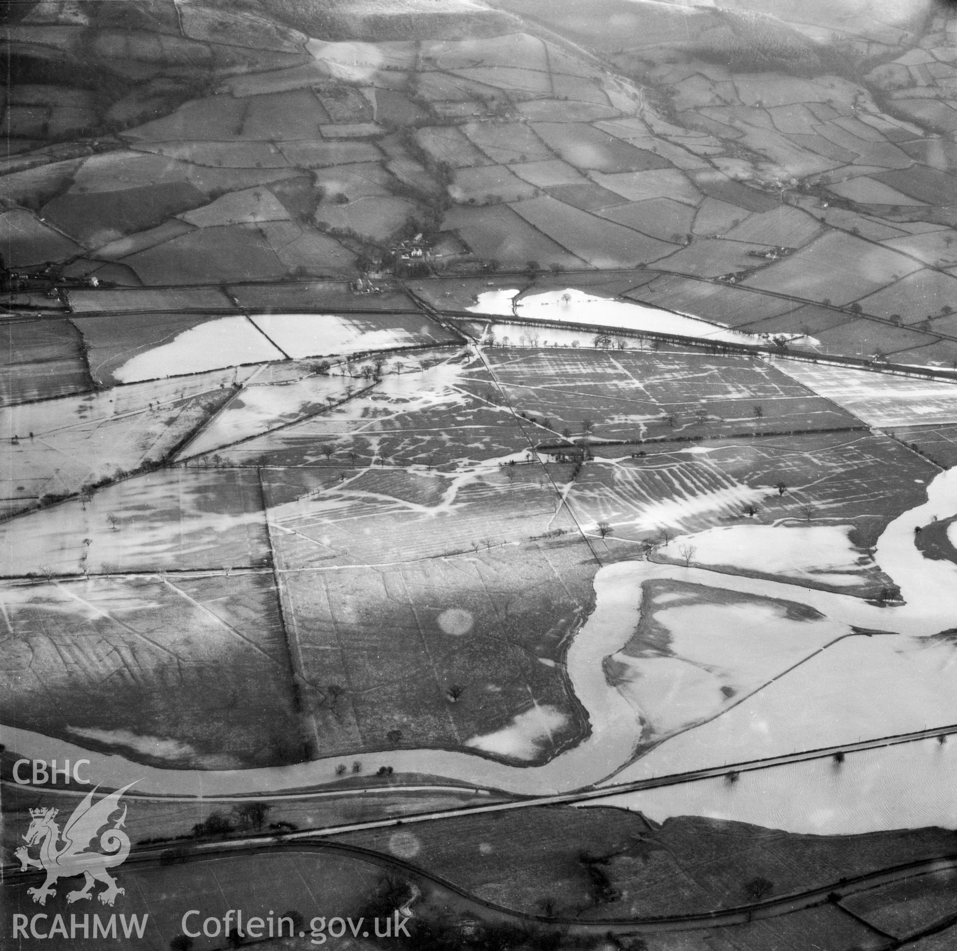 View of the river Severn in flood in the Criggion and Breiddan Hill area. Oblique aerial photograph, 5?" cut roll film.