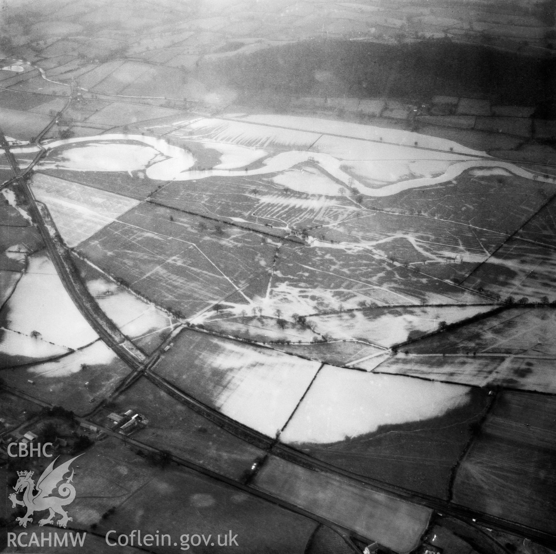 View of the river Severn in flood in the Criggion and Breiddan Hill area. Oblique aerial photograph, 5?" cut roll film.