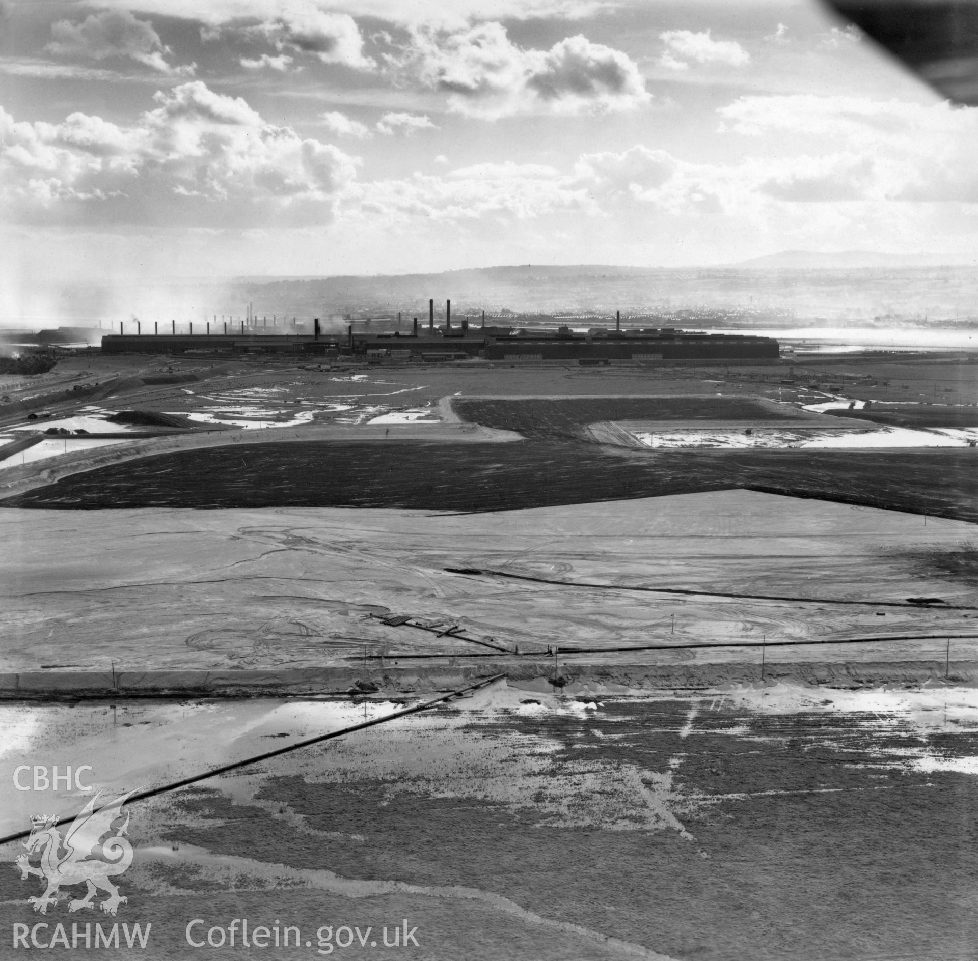 View of of Dee estuary during dreging work for Shotton Steelworks. Commissioned by the Westminster Dredging Co. Ltd.. Oblique aerial photograph, 5?" cut roll film.