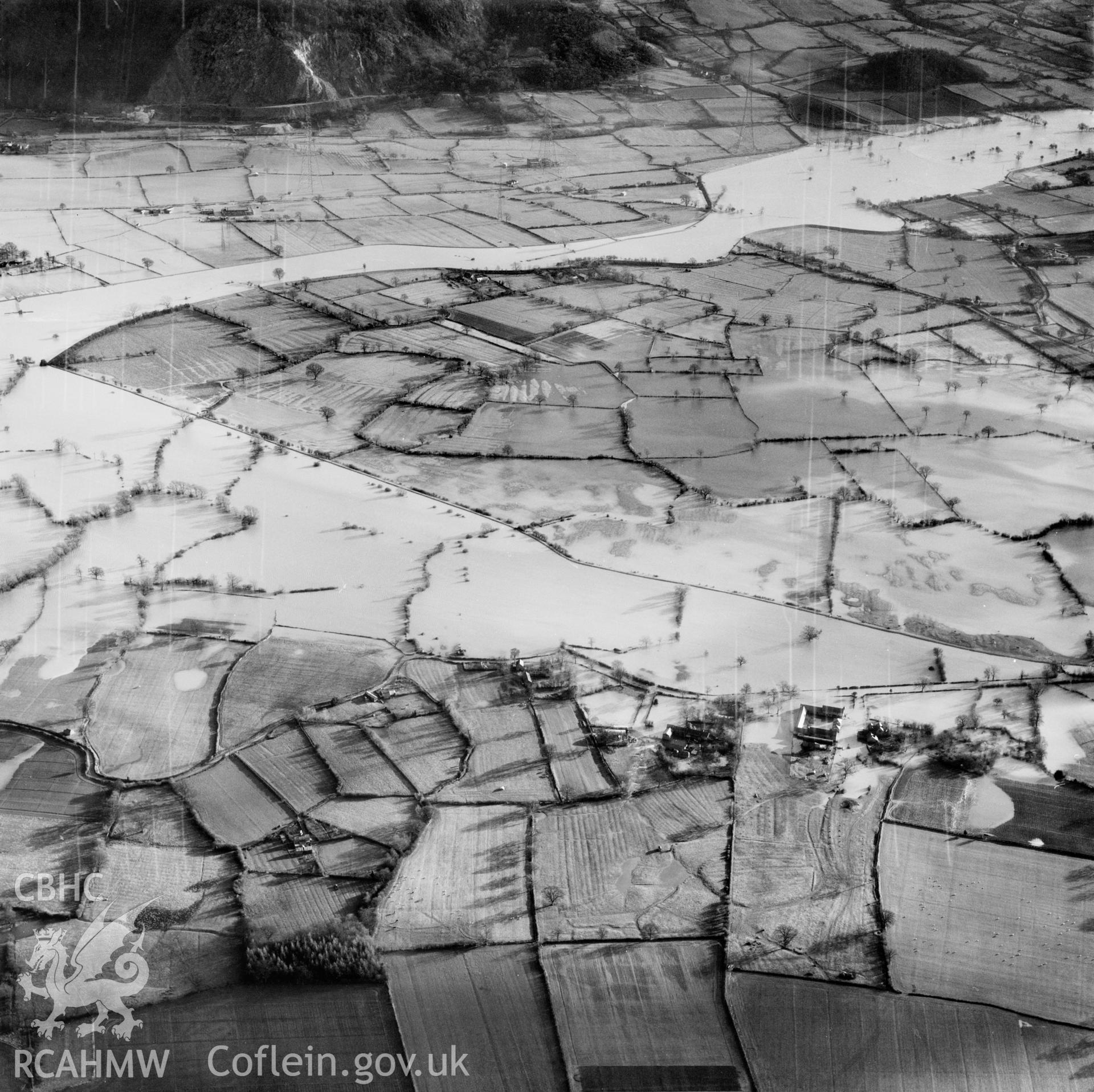 View of the river Severn in flood in the Criggion and Breiddan Hill area. Oblique aerial photograph, 5?" cut roll film.