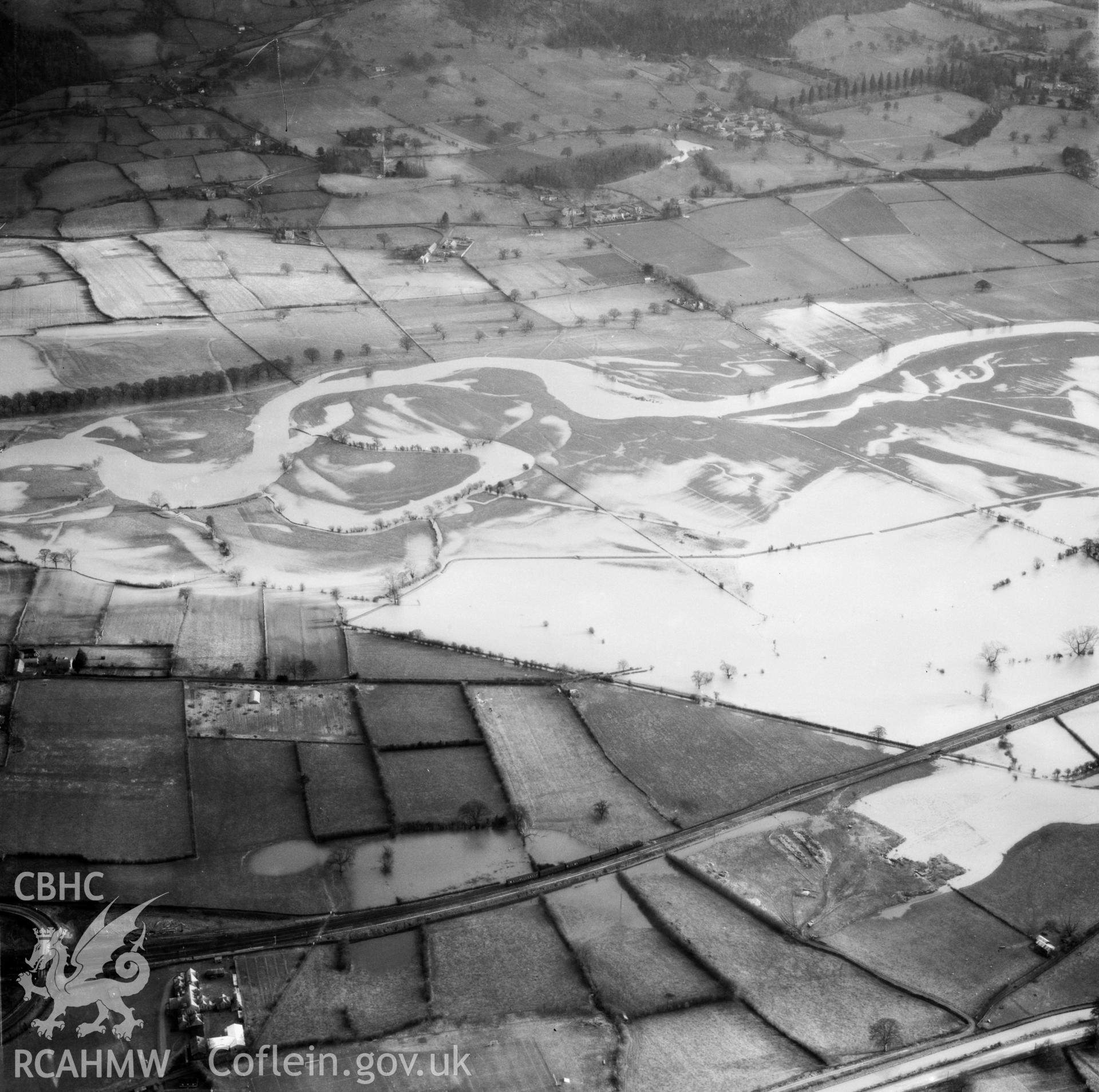 View of the river Severn in flood in the Criggion and Breiddan Hill area. Oblique aerial photograph, 5?" cut roll film.