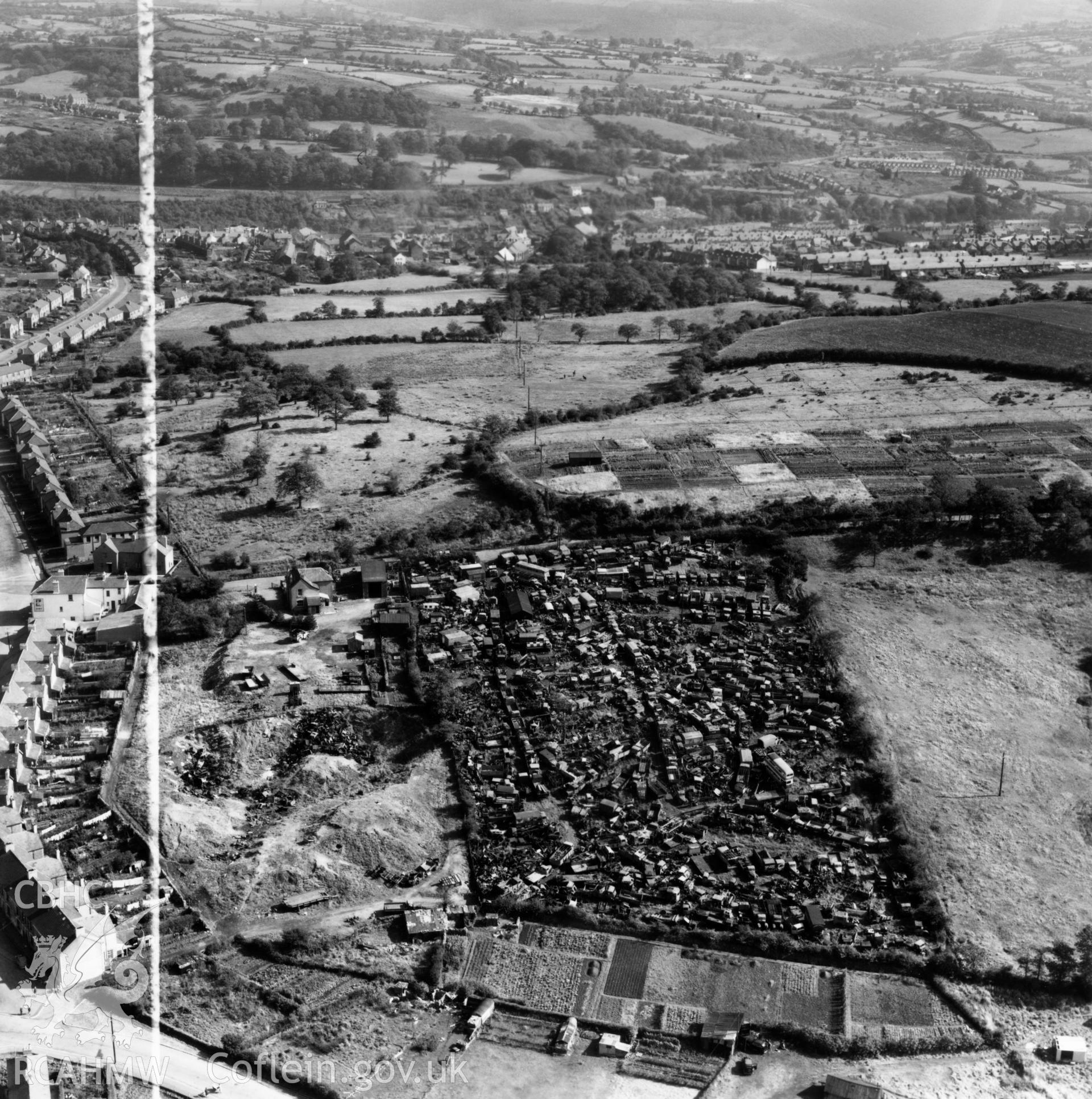 View of Gibbs Brothers vehicle scrap yard at Blackwood, Mynyddislwyn. Oblique aerial photograph, 5?" cut roll film.