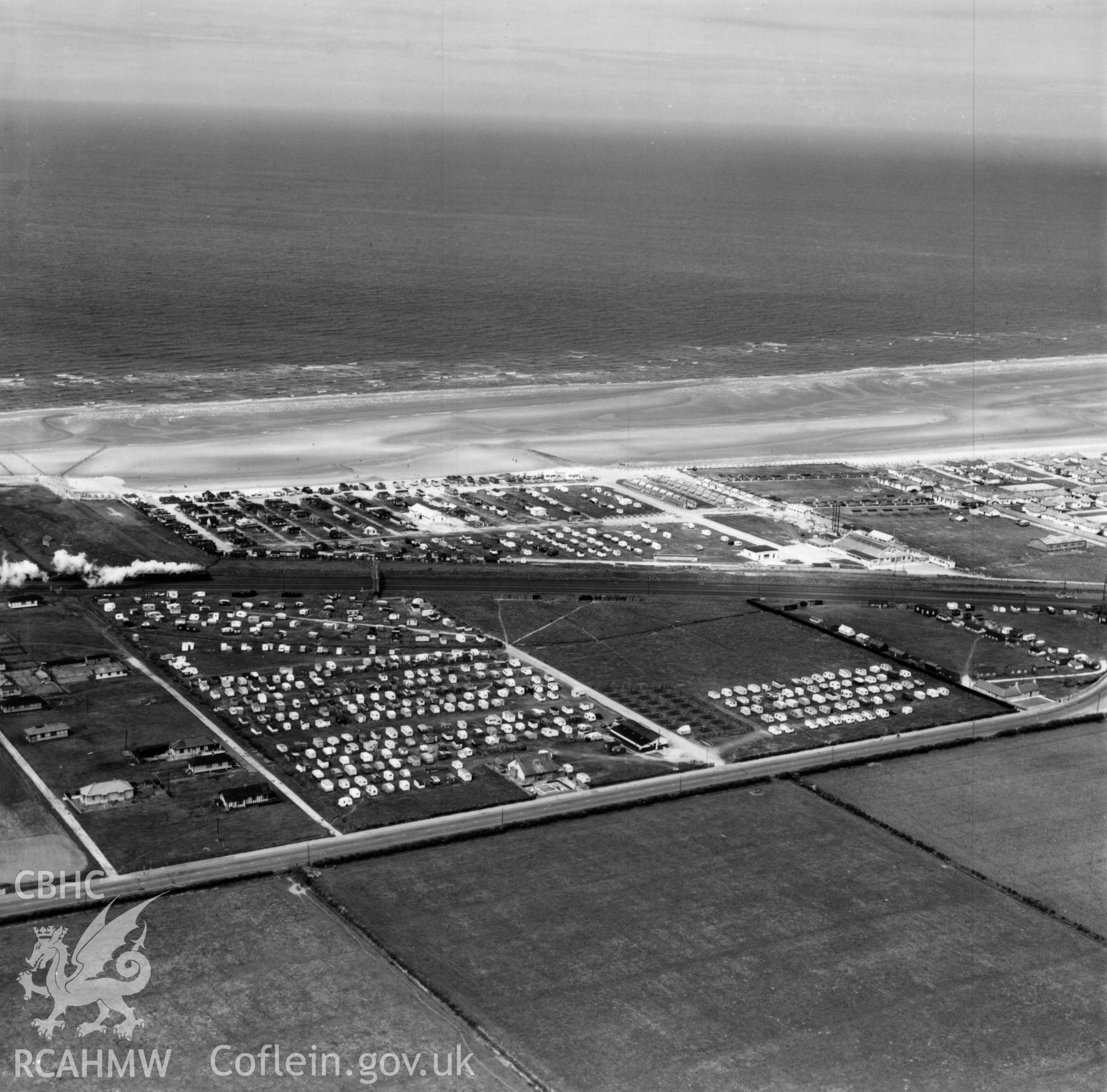 View of Winkups Holiday Camp, Foryd, commissioned by W.H.Smith & Son Ltd.. Oblique aerial photograph, 5?" cut roll film.