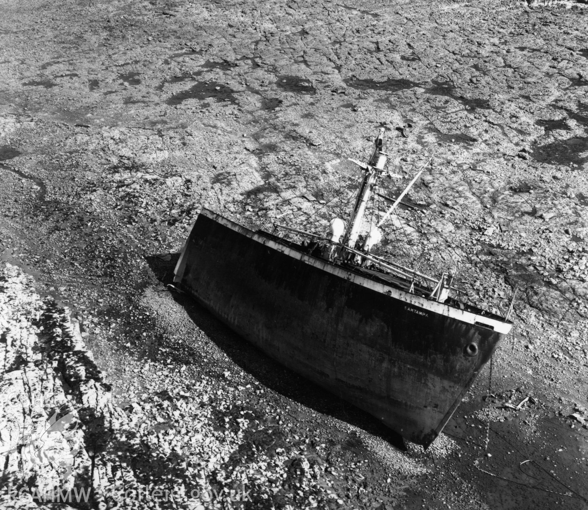 View of the wreck of SS Samtampa off Porthcawl. Oblique aerial photograph, 5?" cut roll film.