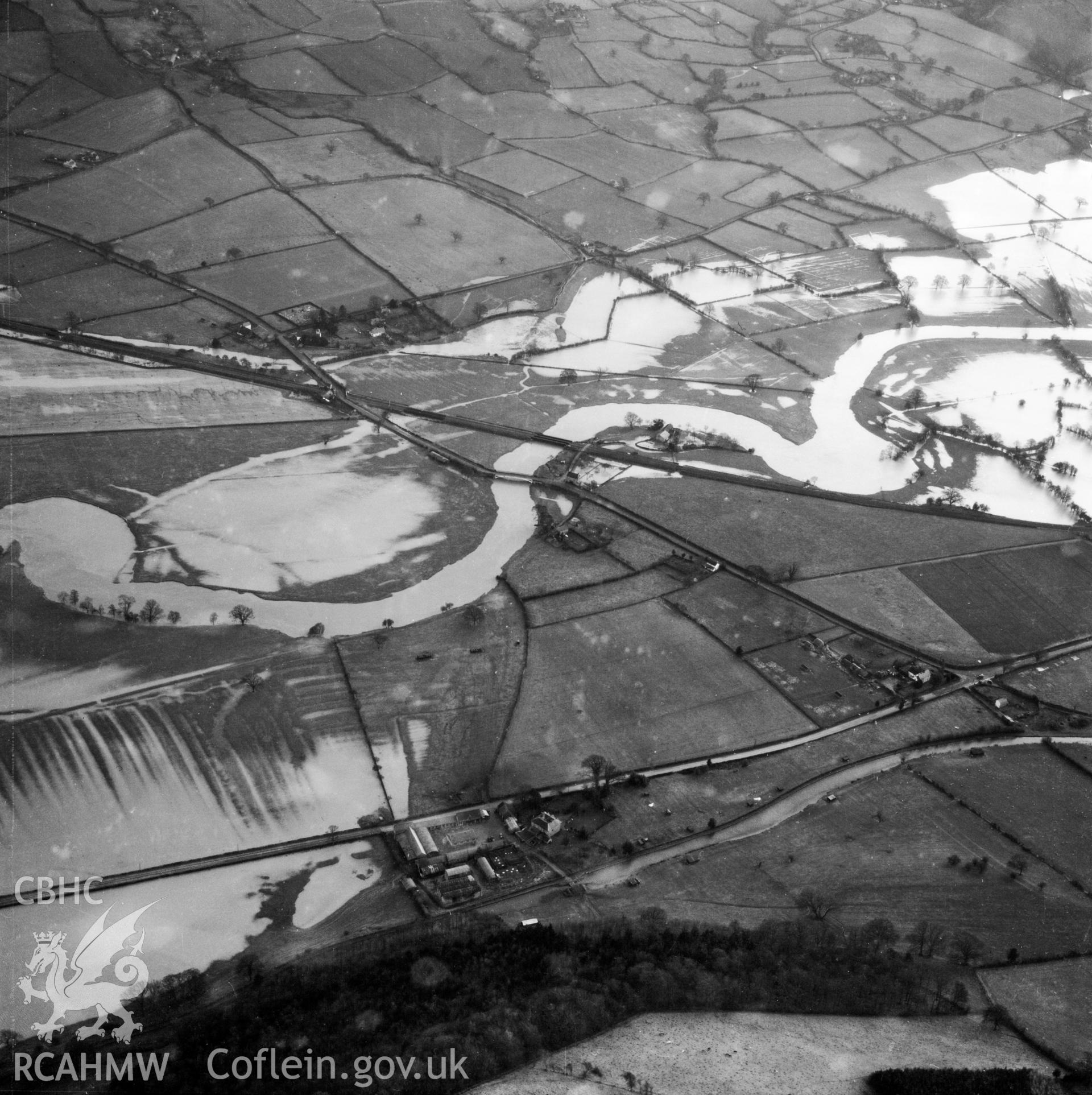 View of the river Severn in flood in the Criggion and Breiddan Hill area. Oblique aerial photograph, 5?" cut roll film.