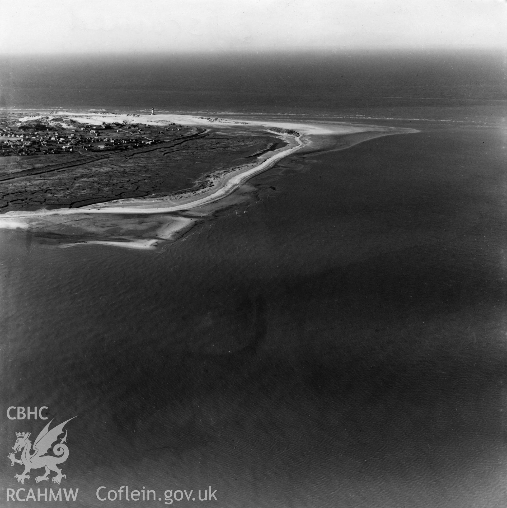 Distant view of the Point of Ayr lighthouse from the east. Oblique aerial photograph, 5?" cut roll film.