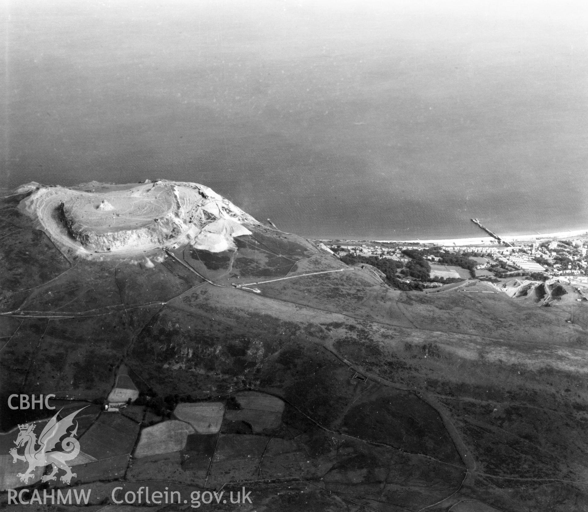 View of Penmaenmawr and Welsh Granite Co. Ltd. Quarries at Penmaenmawr. Oblique aerial photograph, 5?" cut roll film.