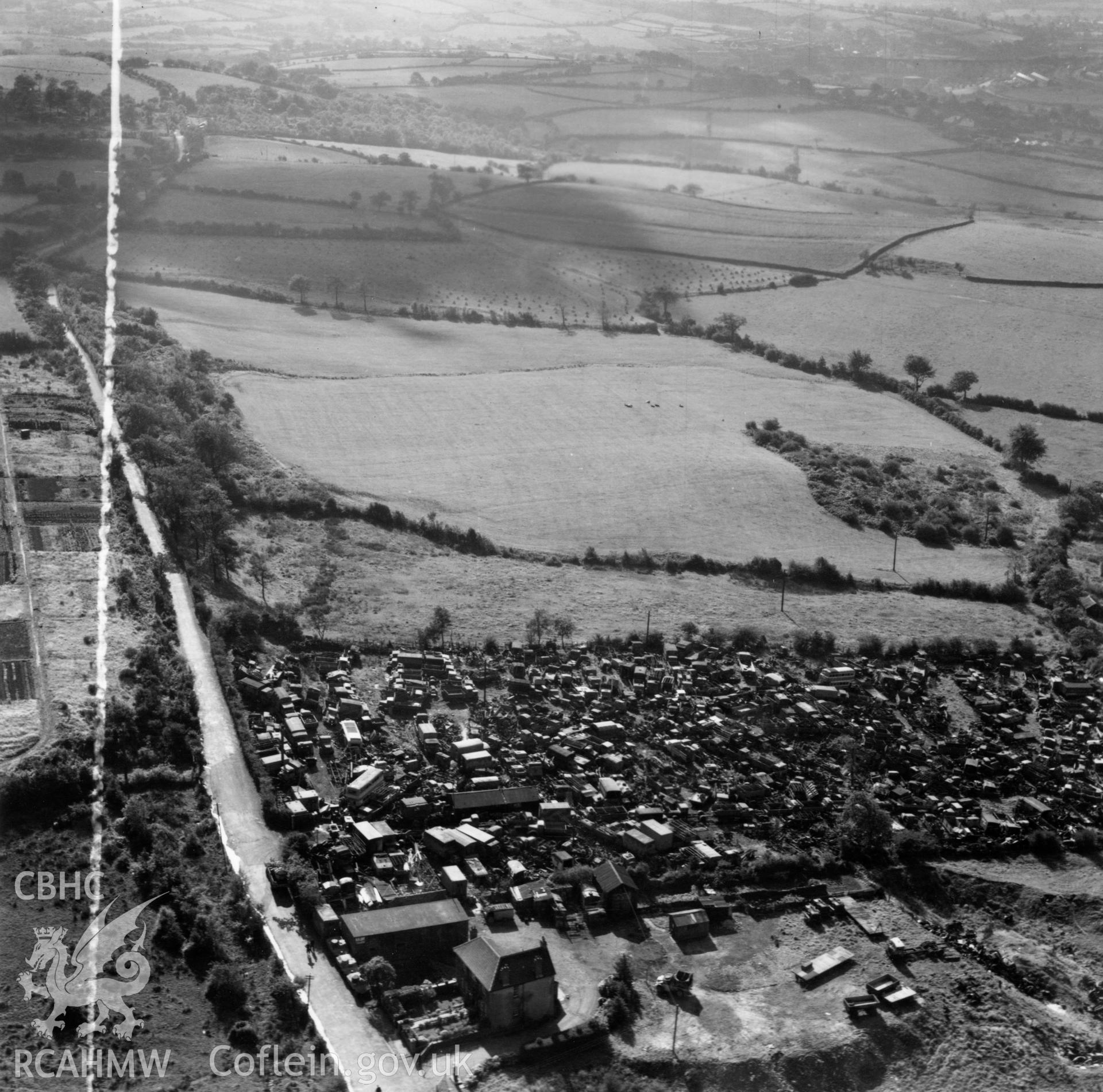 View of Gibbs Brothers vehicle scrap yard at Blackwood, Mynyddislwyn. Oblique aerial photograph, 5?" cut roll film.