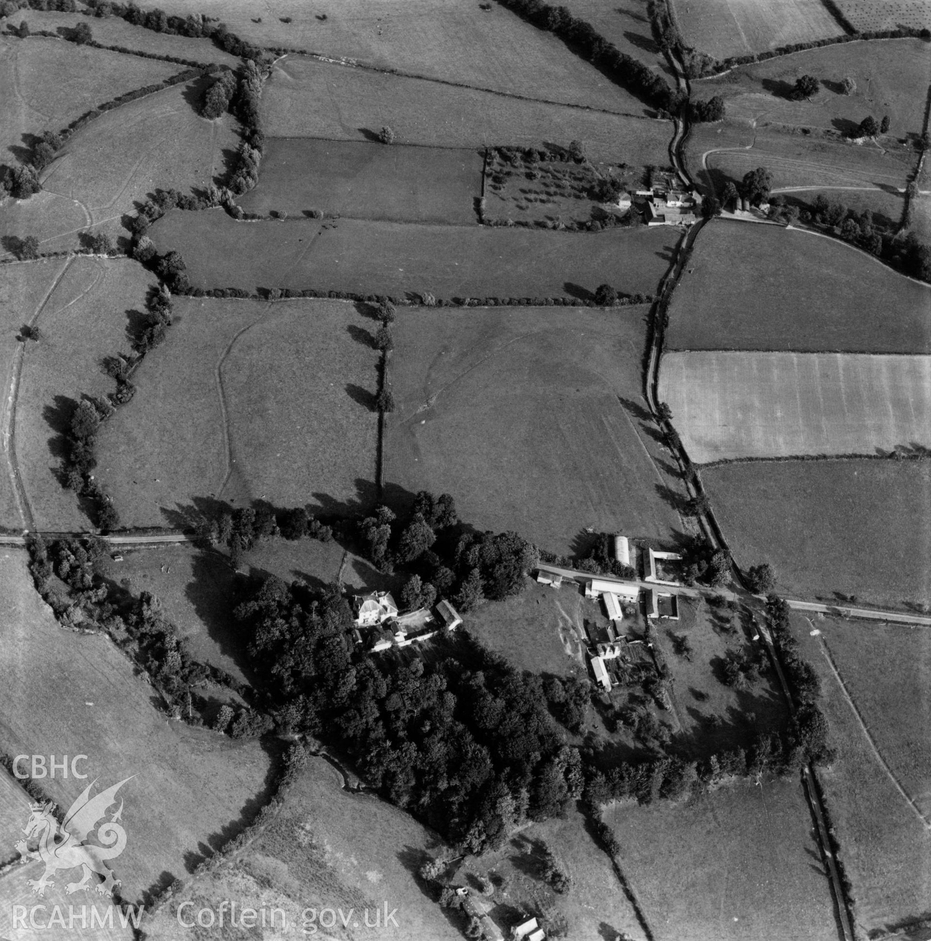 View of Lugg valley showing The Grove, Maes Treylow, and Yew Tree farm in the distance. Oblique aerial photograph, 5?" cut roll film.
