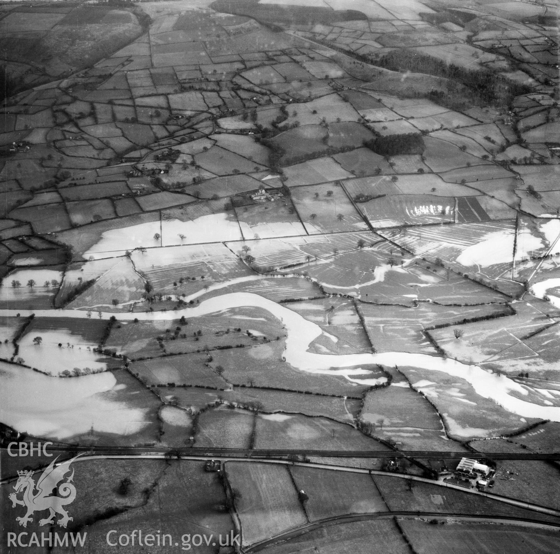 View of the river Severn in flood in the Criggion and Breiddan Hill area. Oblique aerial photograph, 5?" cut roll film.